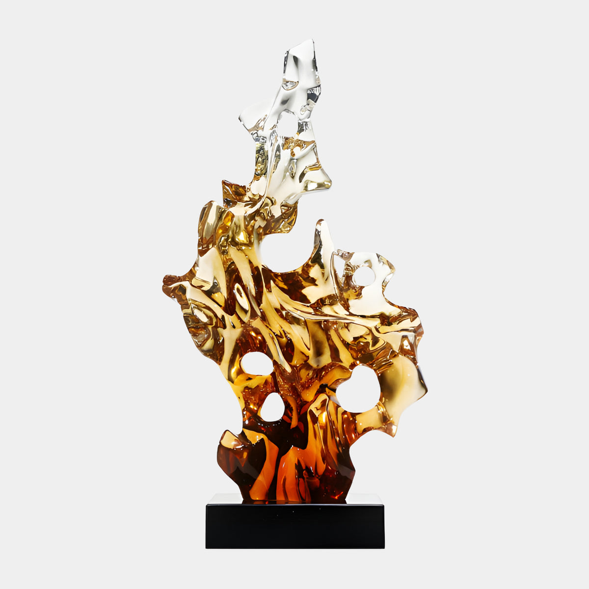 Clear Amber Flame Form Resin Sculpture, 76cm, rising flame-like shape fading from clear to gold to deep amber with pierced openings, on a black marble base against a plain light background.
