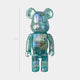 The Aqua Mirage Bear Sculpture - 70cm by Giant Sculptures is a translucent blue-green bear with X-girl on its chest, standing upright against a plain white background.
