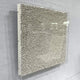 TerraLuma Ivory White Bloom Paper Craft 3D Wall Art, side angle view showing hand-coiled paper rosettes in a radiating pattern, framed in acrylic on a light grey wall.