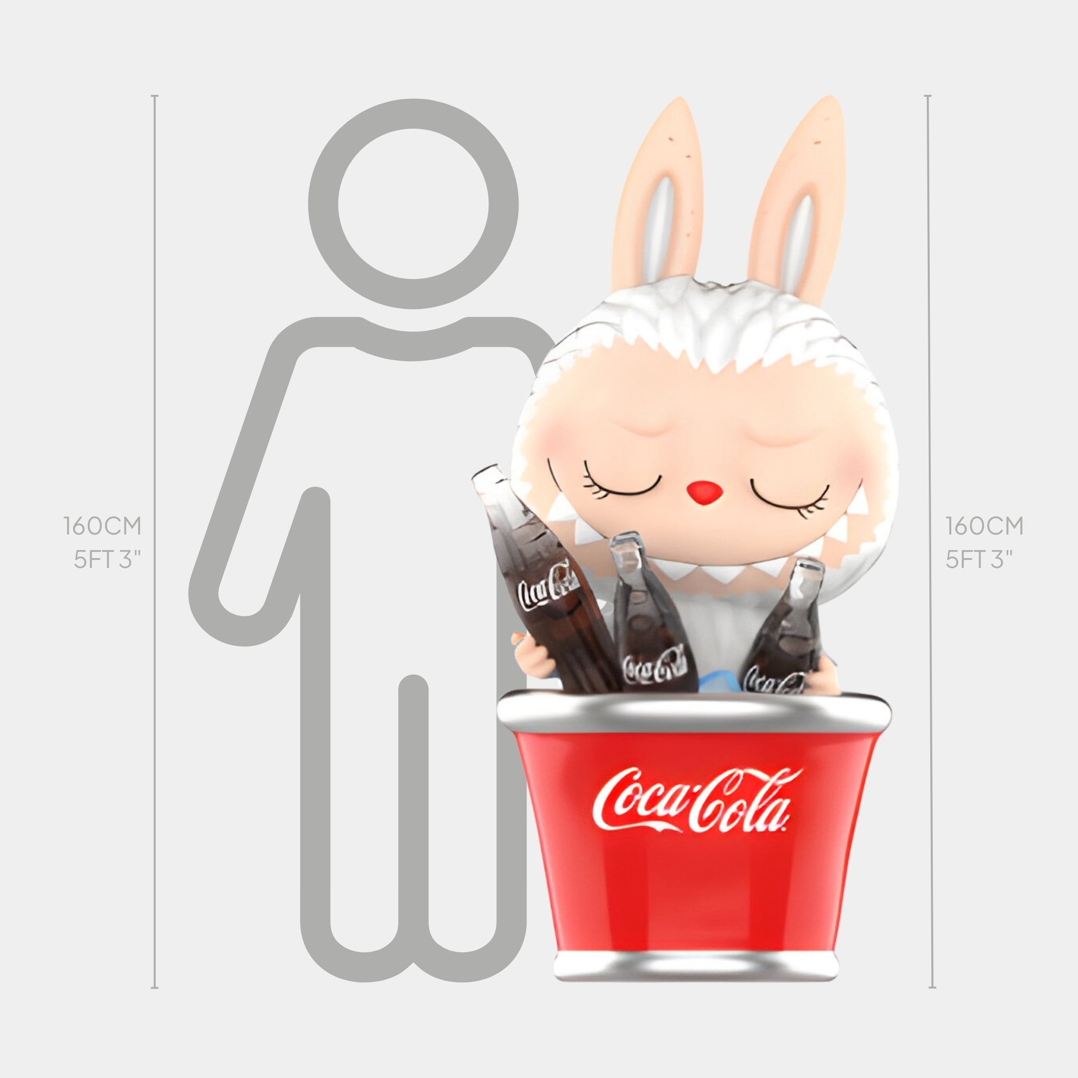 The Cool Bucket Coca-Cola Labubu Sculpture by Giant Sculptures, featuring bunny ears and closed eyes, sits in a red Coke bucket with glass bottles and stands 160cm tall, matching the height of a 5ft 3in human outline.