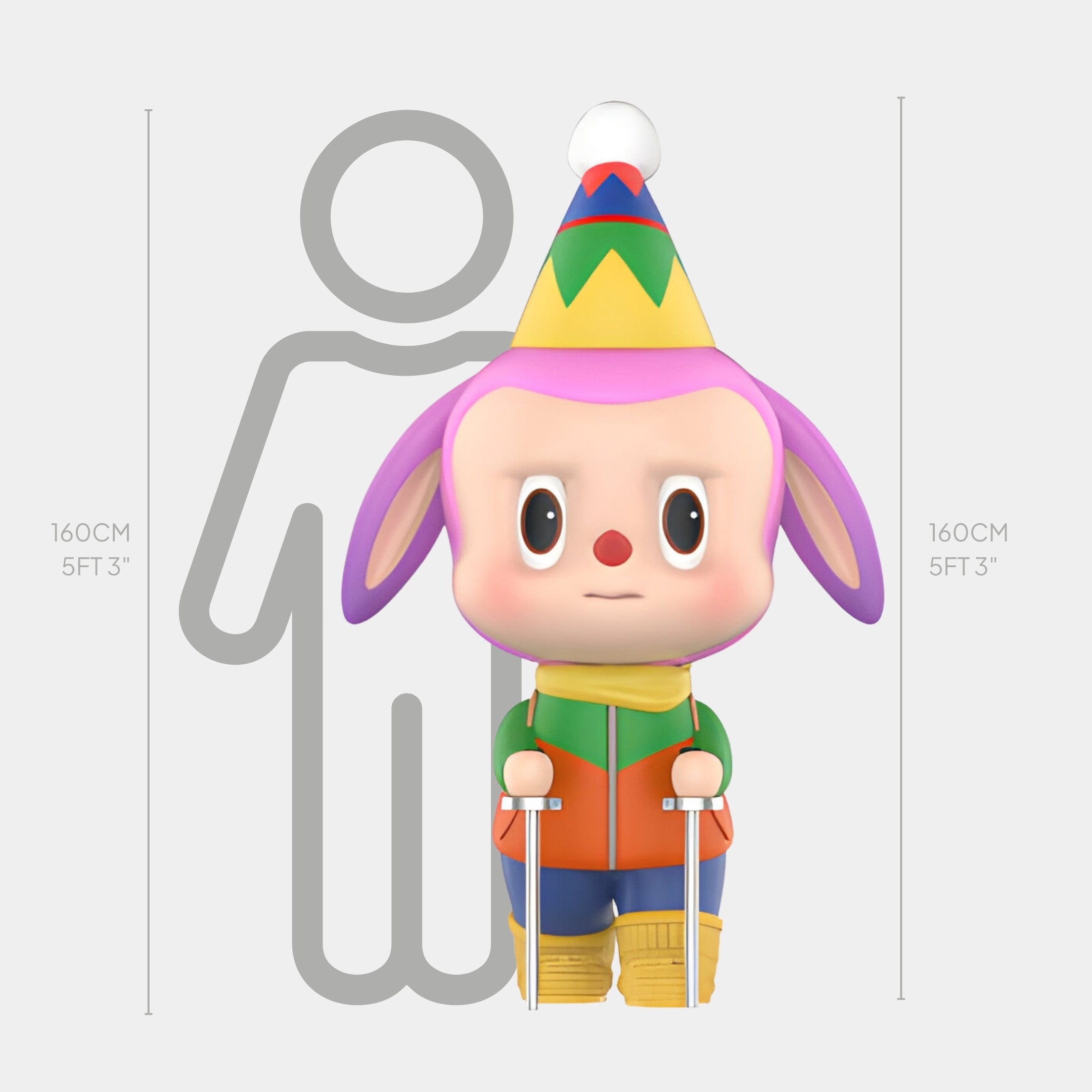 The Camp Life Trekker Labubu Sculpture by Giant Sculptures stands 160cm (5ft 3in) tall. Featuring a cartoon character with pink ears, party hat, and crutches, this colorful indoor fibreglass piece stands beside a gray human silhouette.