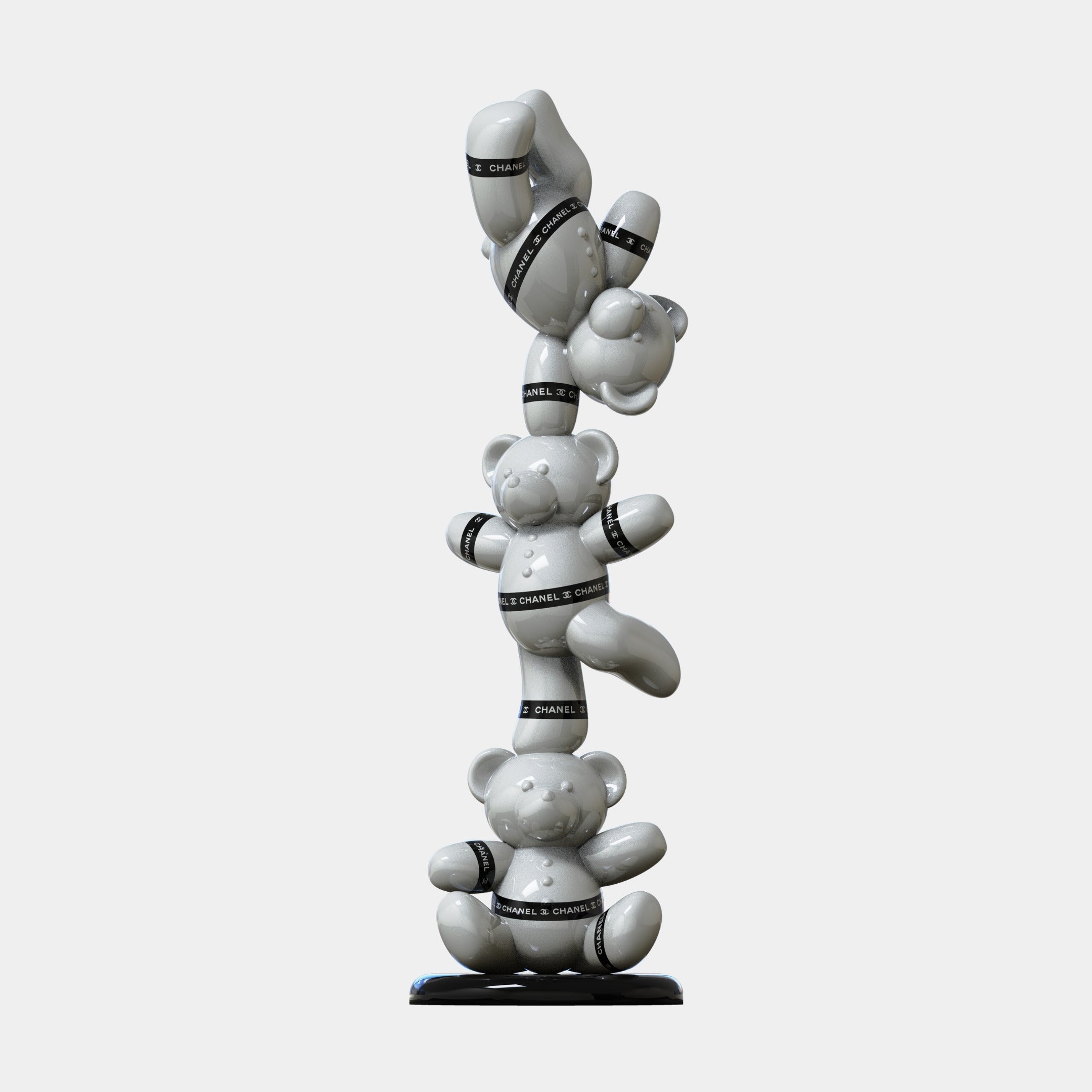 Three white teddy bears wrapped in black "CHANEL" bands are stacked vertically in the Gacko Chanel Triple Bear Sculpture - 90cm by Giant Sculptures—a bold, luxury decor piece for modern interiors.