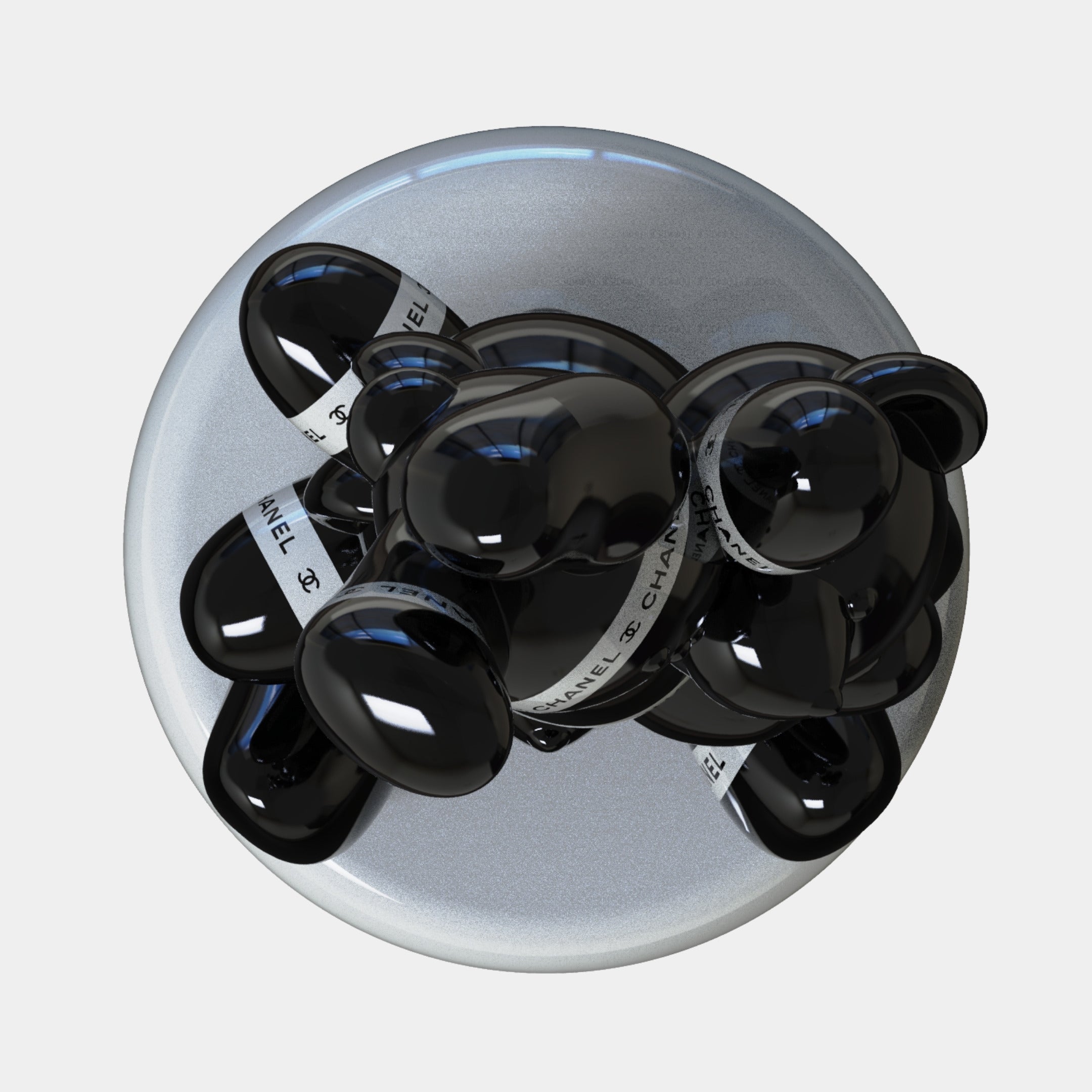 The Gacko Black Chanel Triple Bear Sculpture (90cm) by Giant Sculptures features a glossy abstract black bear with rounded shapes, white bands with "CHANEL" in black text, and rests on a flat silver base—a striking piece of contemporary art decor.