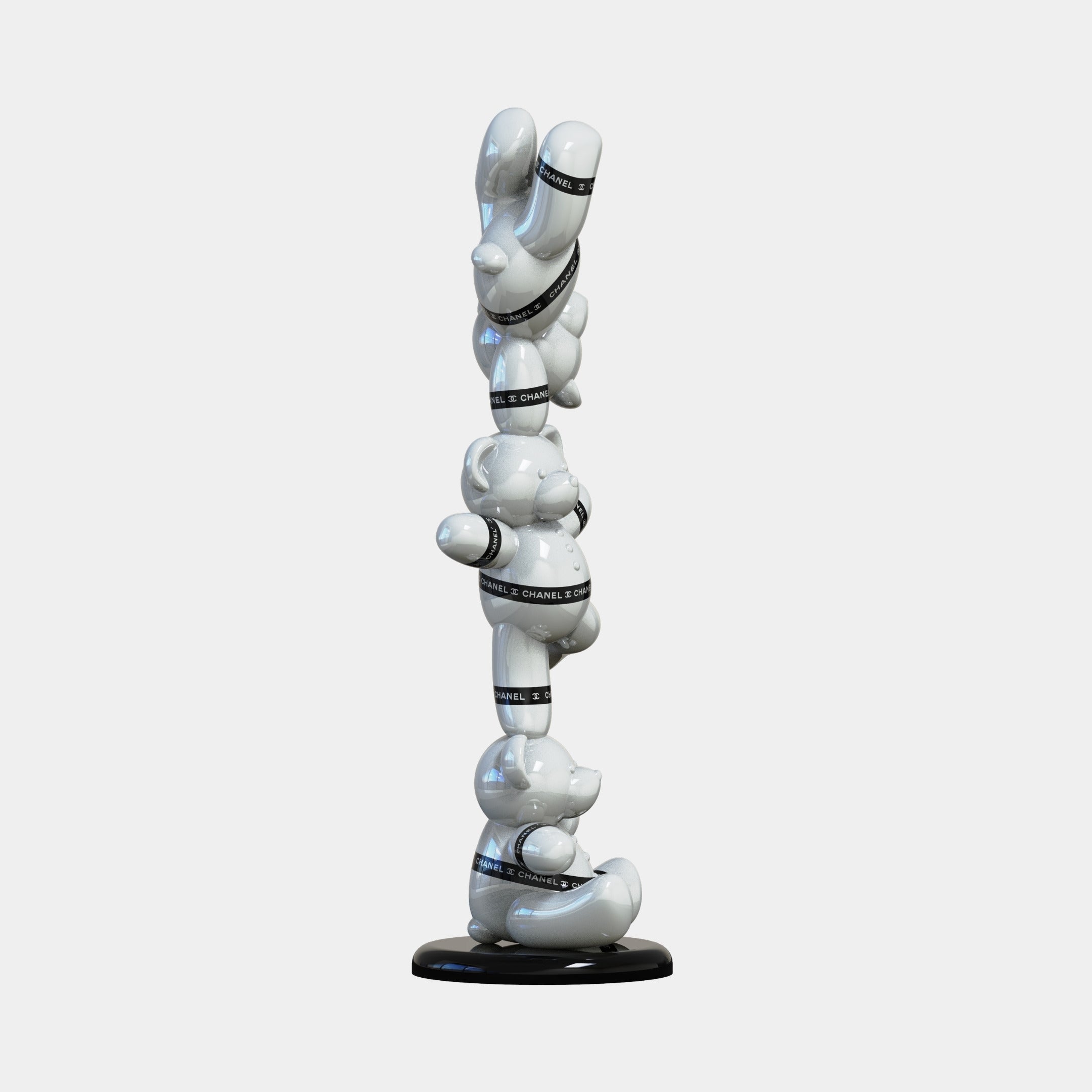 The Gacko Chanel Triple Bear Sculpture - 90cm by Giant Sculptures features three glossy white bears with CHANEL bands, stacked on a round black base—a striking modern décor piece for luxury interiors.