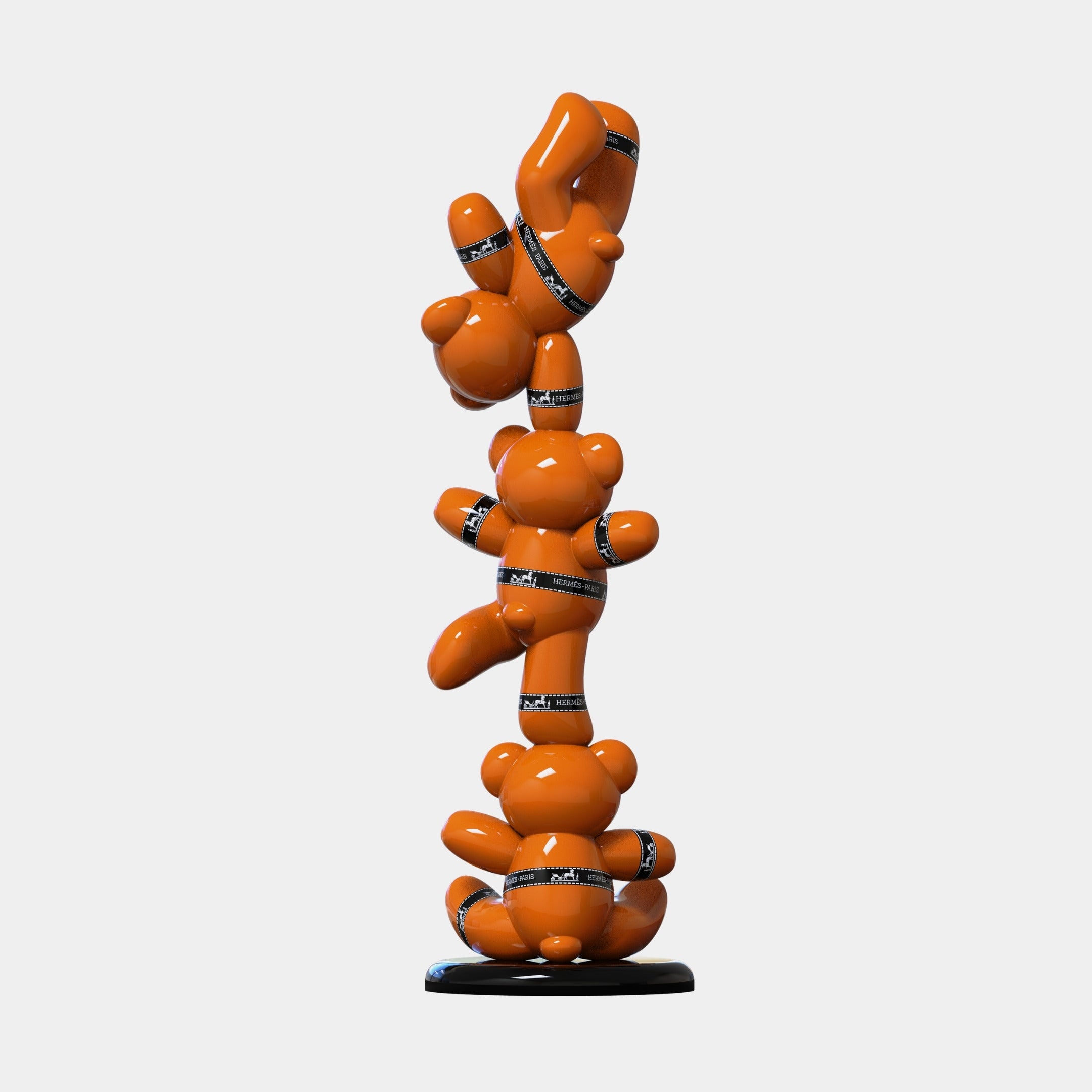 The Gacko Hermes Triple Bear Sculpture (90cm) by Giant Sculptures features three glossy orange bears stacked and wrapped in "Fragile" black tape—a bold contemporary centerpiece for luxury home decor.