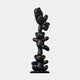 The Gacko Matte Multicoloured LV Triple Bear Sculpture - 90cm by Giant Sculptures features three stacked black teddy bears with colorful LV-inspired symbols, set on a round base against a plain backdrop.