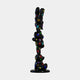 A glossy black pop art bear sculpture with abstract shapes and colorful Louis Vuitton-inspired logos, reminiscent of the Gacko Multicoloured LV Triple Bear Sculpture - 90cm by Giant Sculptures, stands vertically on a round base against a plain white background.