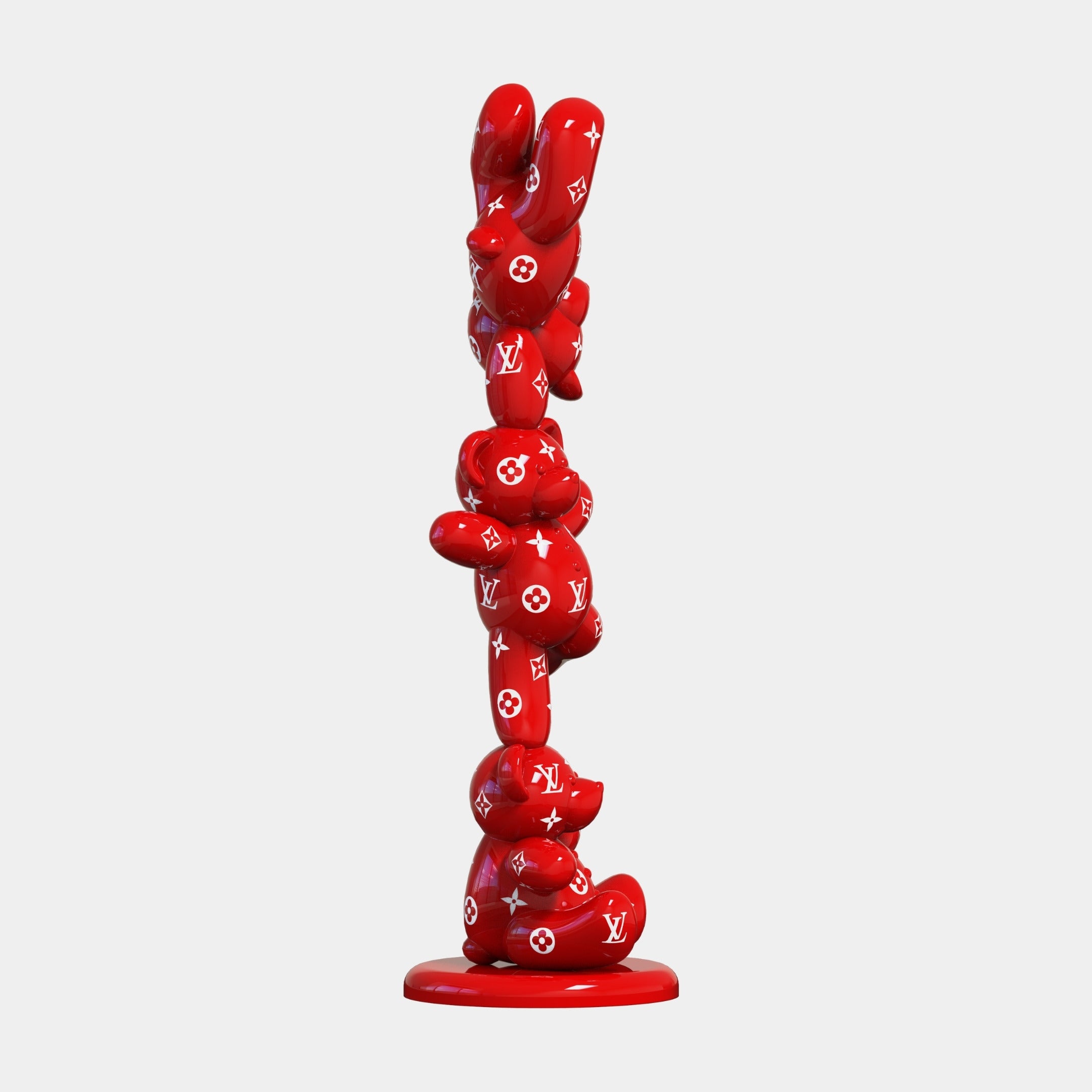 The Gacko Rouge LV Triple Bear Sculpture by Giant Sculptures stands 90cm tall with glossy red, organic forms stacked vertically. White Louis Vuitton logos and flower motifs cover its surface, making it a striking luxury decor piece on a circular base.