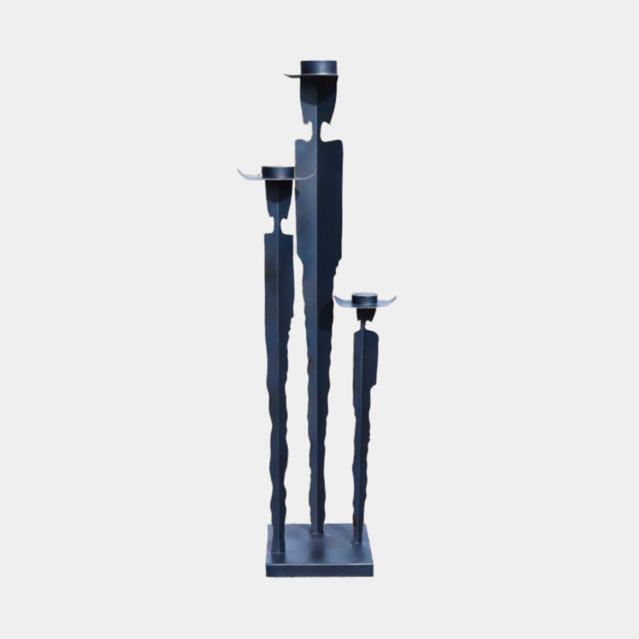 Giant Sculptures' 180cm Black Minimalist Abstract Figurine Metal Sculpture featuring three slender silhouettes with candle-holder discs on a shared base, against a plain background.
