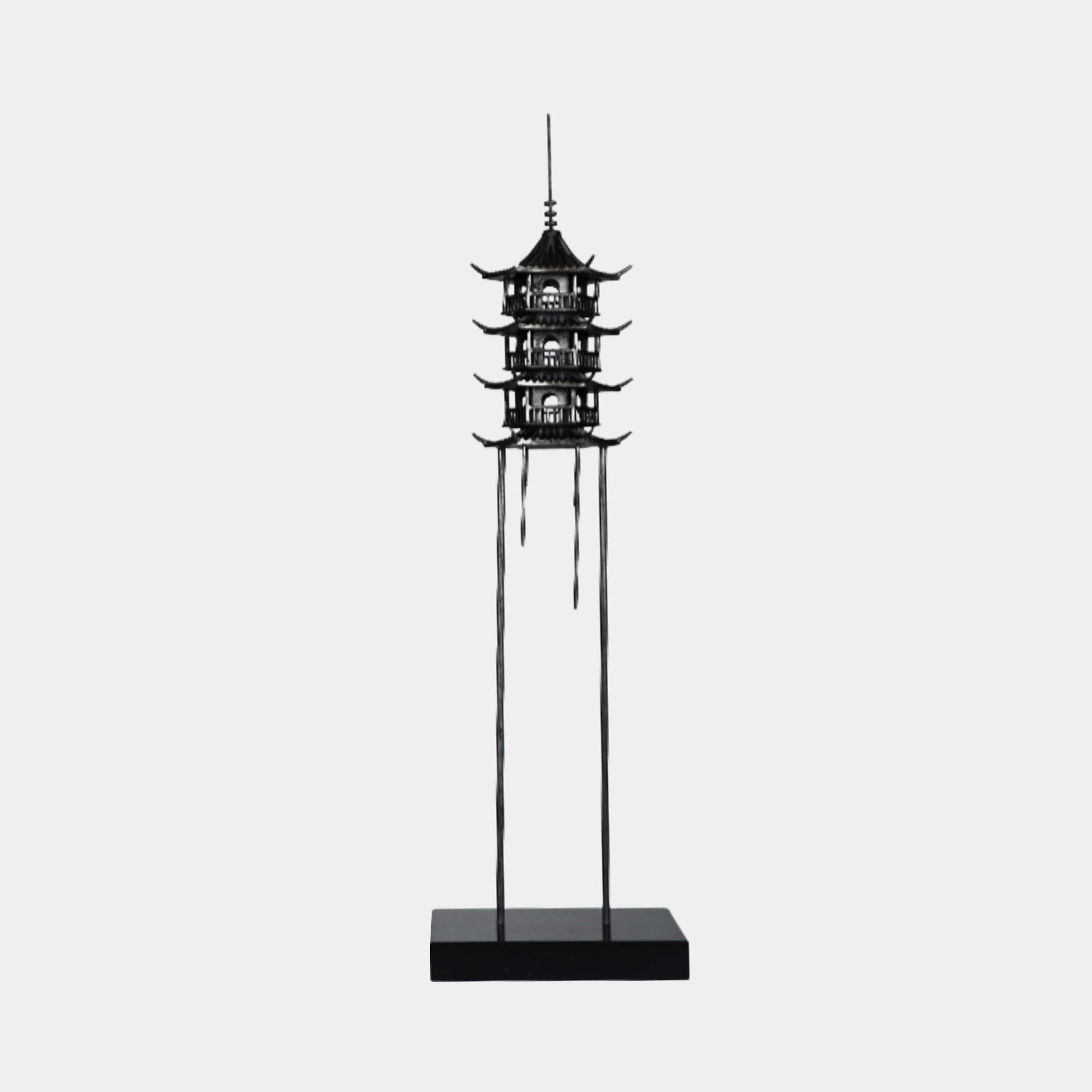 Black Zen Tiered Pagoda Tower Metal Sculpture by Giant Sculptures, 130cm, four-tiered pagoda on tall slender legs with spire finial, on a black rectangular base.