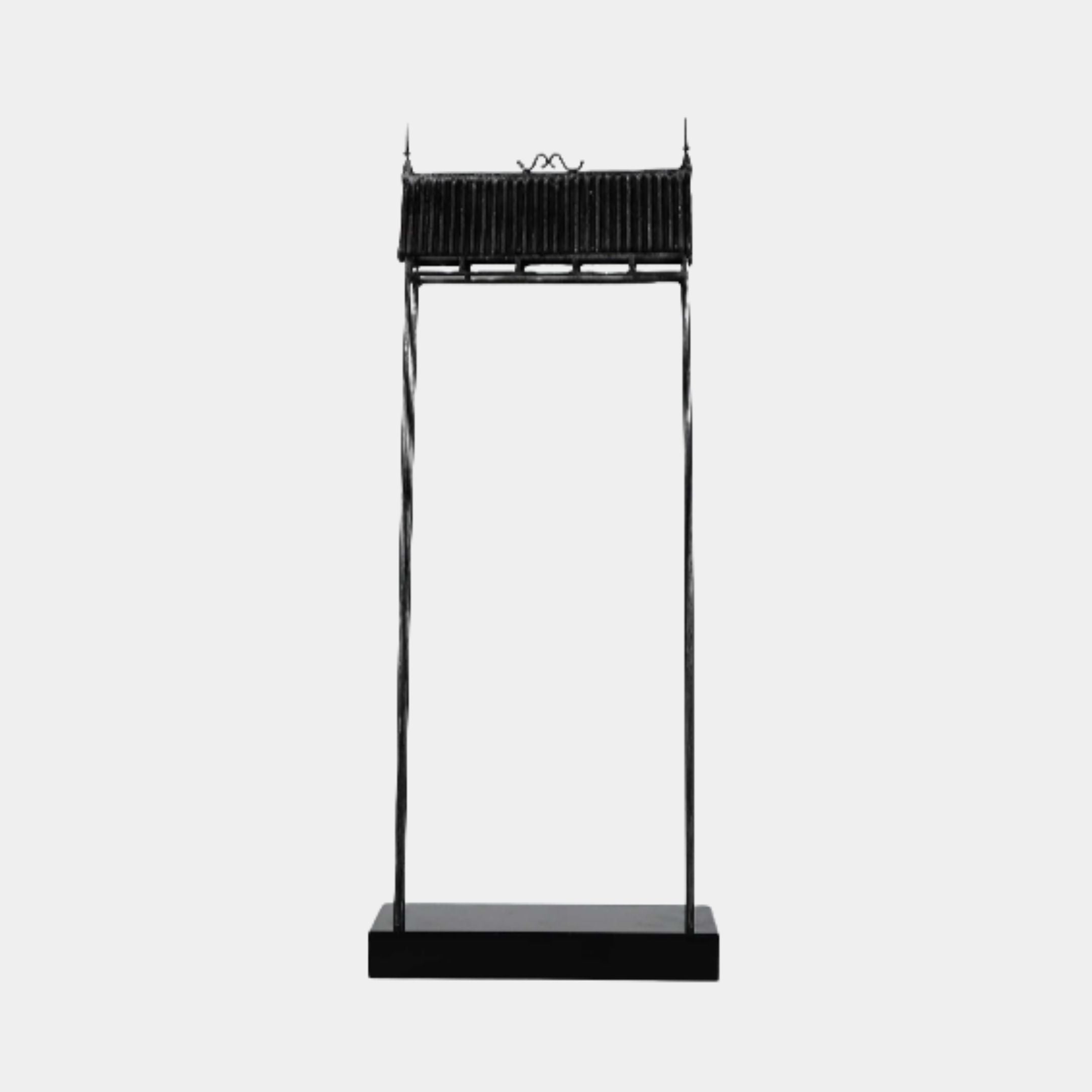 Black Traditional Gate Tower Metal Sculpture by Giant Sculptures, 103cm tall with twisted legs and tiled roof detailing on a rectangular plinth, shown on a plain background.