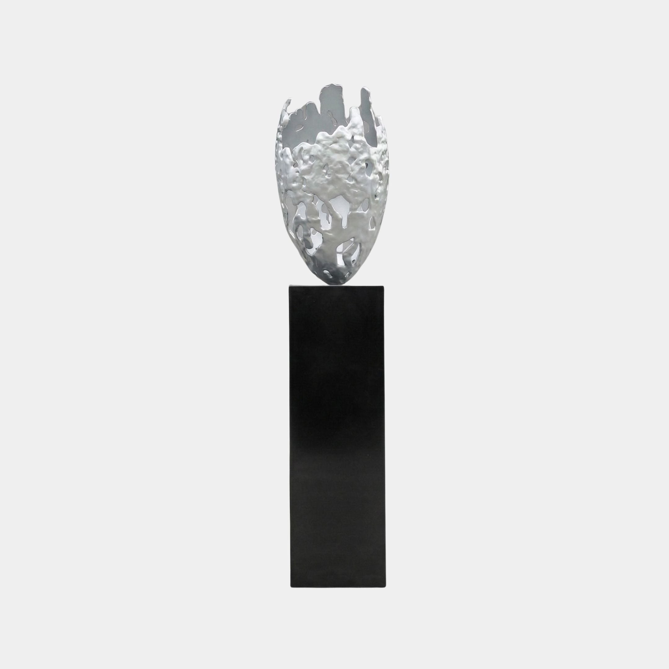 Silver Crystal Vase Abstract Metal Sculpture by Giant Sculptures, a polished aluminium vessel with torn rim and organic perforations on a tall black plinth.