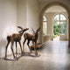 Giant Sculptures Traditional Standing Fawn Pair Bronze Sculpture 90cm displayed in an arched hallway with garden view, showing two spotted fawns on integrated bases.