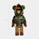 The Giant Sculptures Valor Split Bear Sculpture - 70cm showcases streetwear style with a military-green half-hoodie, shark-hood detail, brown gloves, camo pants, and a plain light gray background.