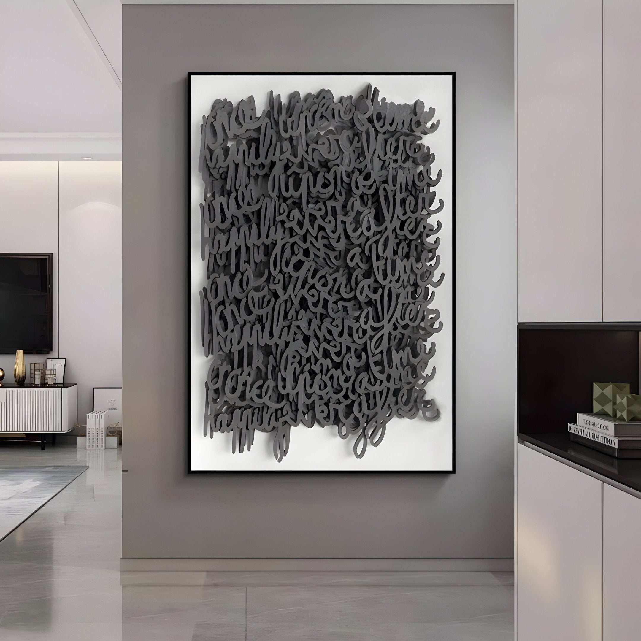 The Oratoria Charcoal Grey Scripted Wood Carving Hand-Painted 3D Wall Art by Giant Sculptures graces a white wall in a modern, minimalist living room. It features tangled black, script-like shapes, with a glossy floor and sleek cabinet enhancing the charcoal grey accents.