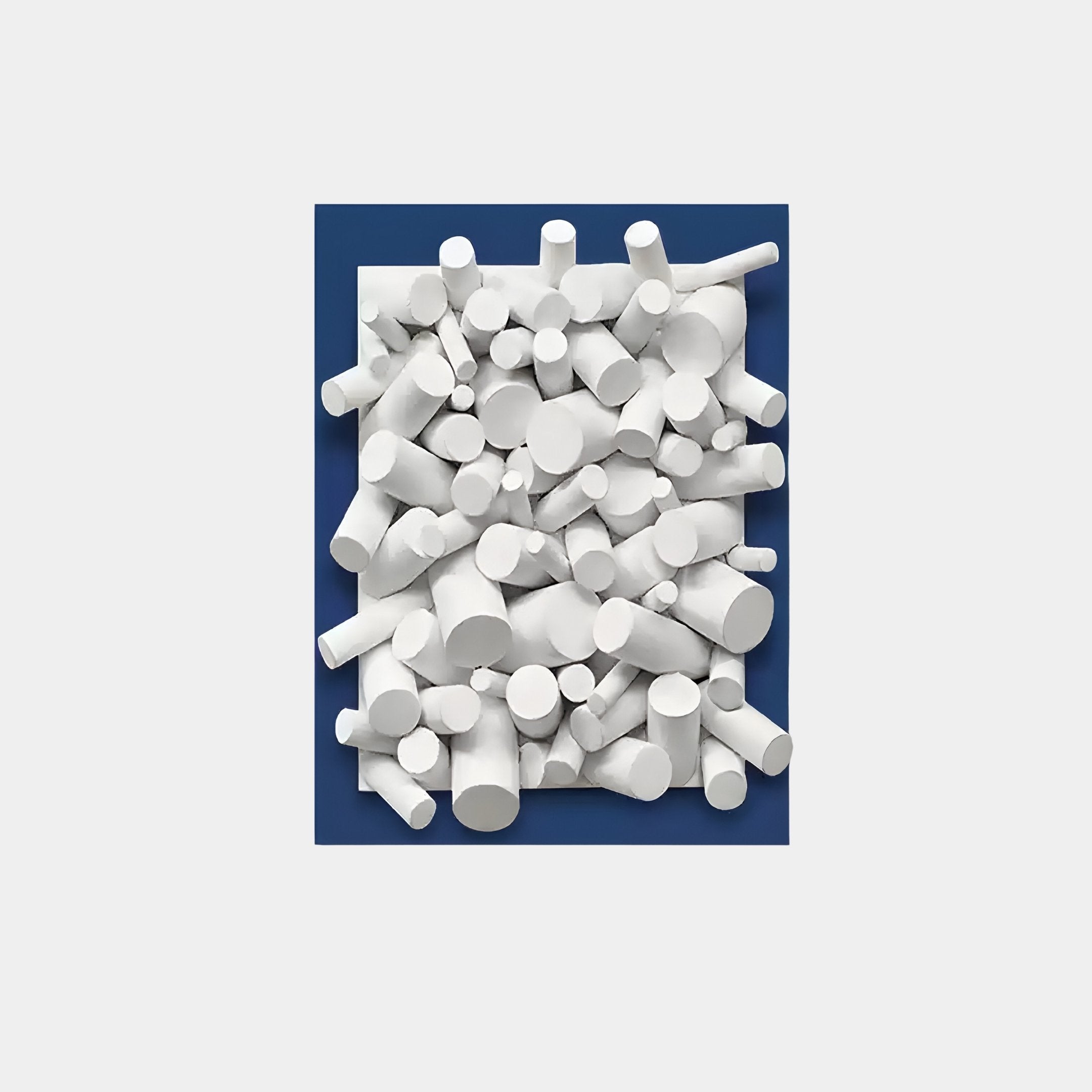 The Axion White Wood Cluster & Sapphire Blue Edge 3D Wall Art by Giant Sculptures features white cylindrical objects in various sizes, arranged on a sapphire blue-edged square background for a striking 3D effect.