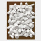 The Axion White Wood Cluster & Deep Oak Edge 3D Wall Art by Giant Sculptures features a modern design with white cylindrical forms emerging from a deep oak background, creating a striking, abstract rectangular centerpiece.