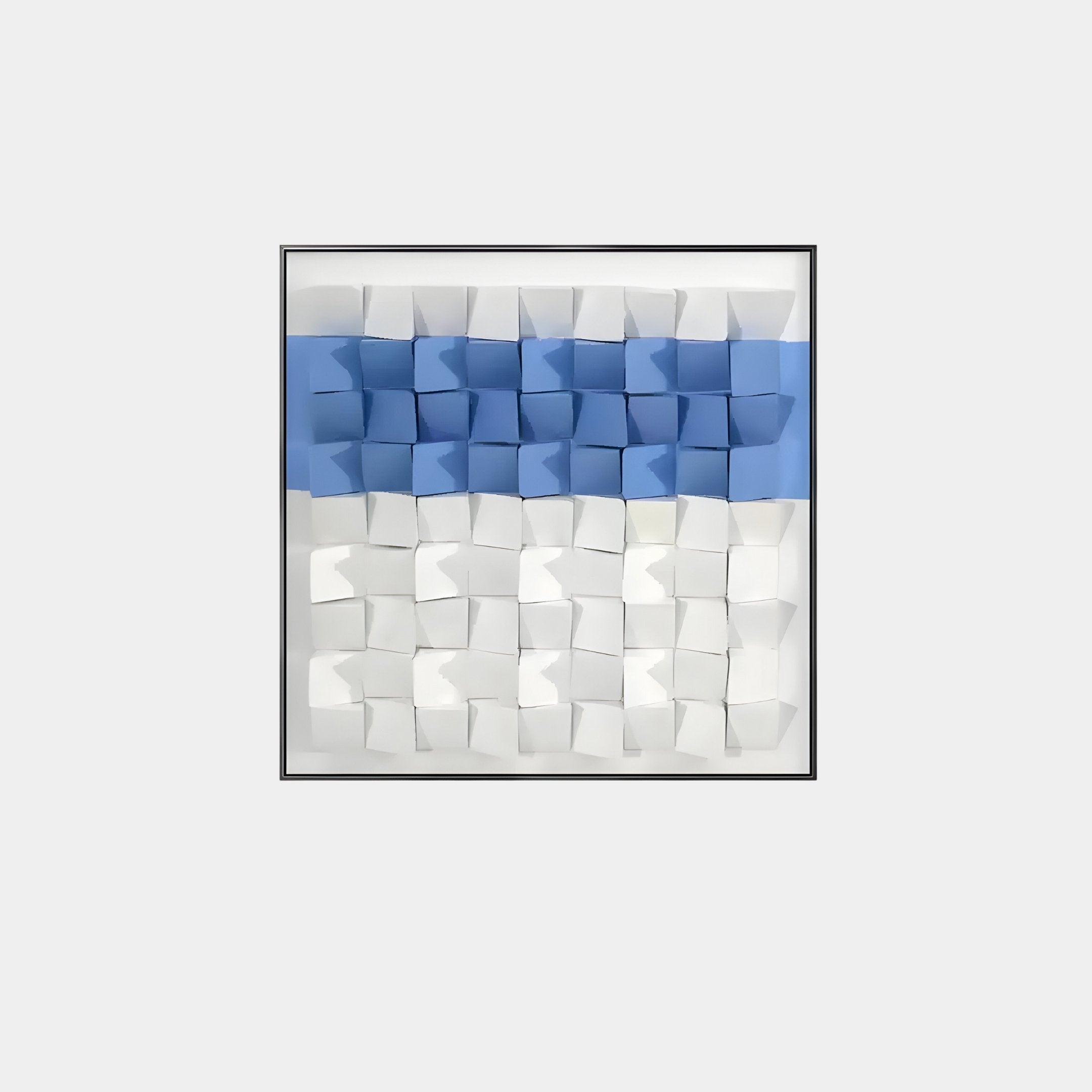 Tessera White & Blue I Geometric Wood 3D Wall Art by Giant Sculptures is a square piece with a modern geometric design. It features a grid of folded paper with blue squares on the top row and white ones below, enhanced by hand-painted finishes creating depth and intrigue in each three-dimensional square.