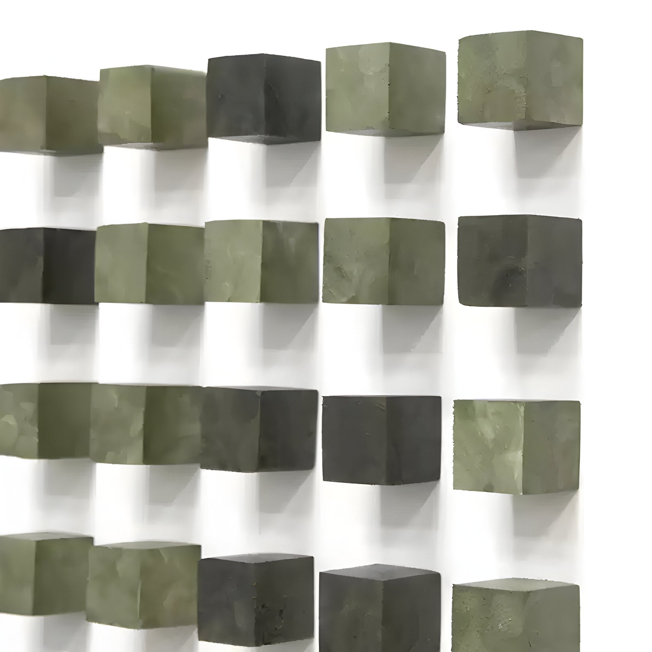 The Cubitara Green Gradient Wood Block 3D Wall Art by Giant Sculptures features staggered green and gray blocks on a white wall, creating a striking three-dimensional effect with intricate shadows.