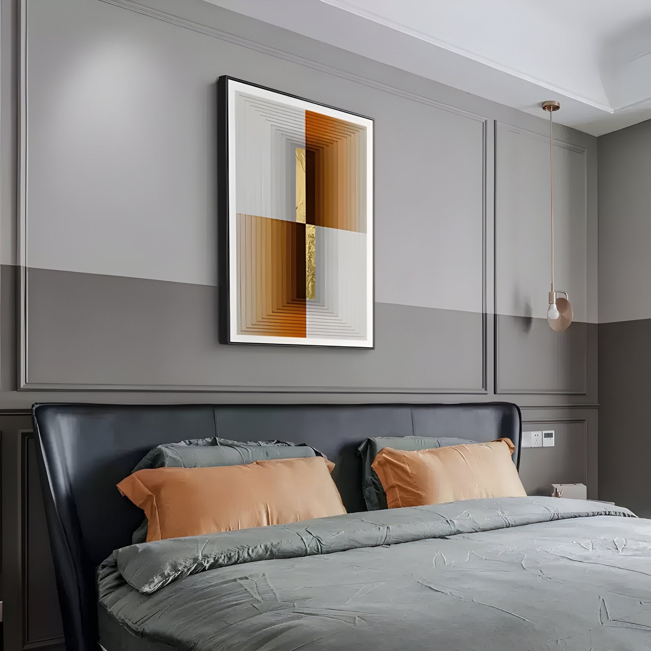 A modern bedroom showcases a double bed with gray bedding and tan pillows. The walls, in two shades of gray, feature the Striato Bronze & Grey Wood Quadrant 3D Wall Art with Gold Accent by Giant Sculptures. A pendant light hangs beside the bed.