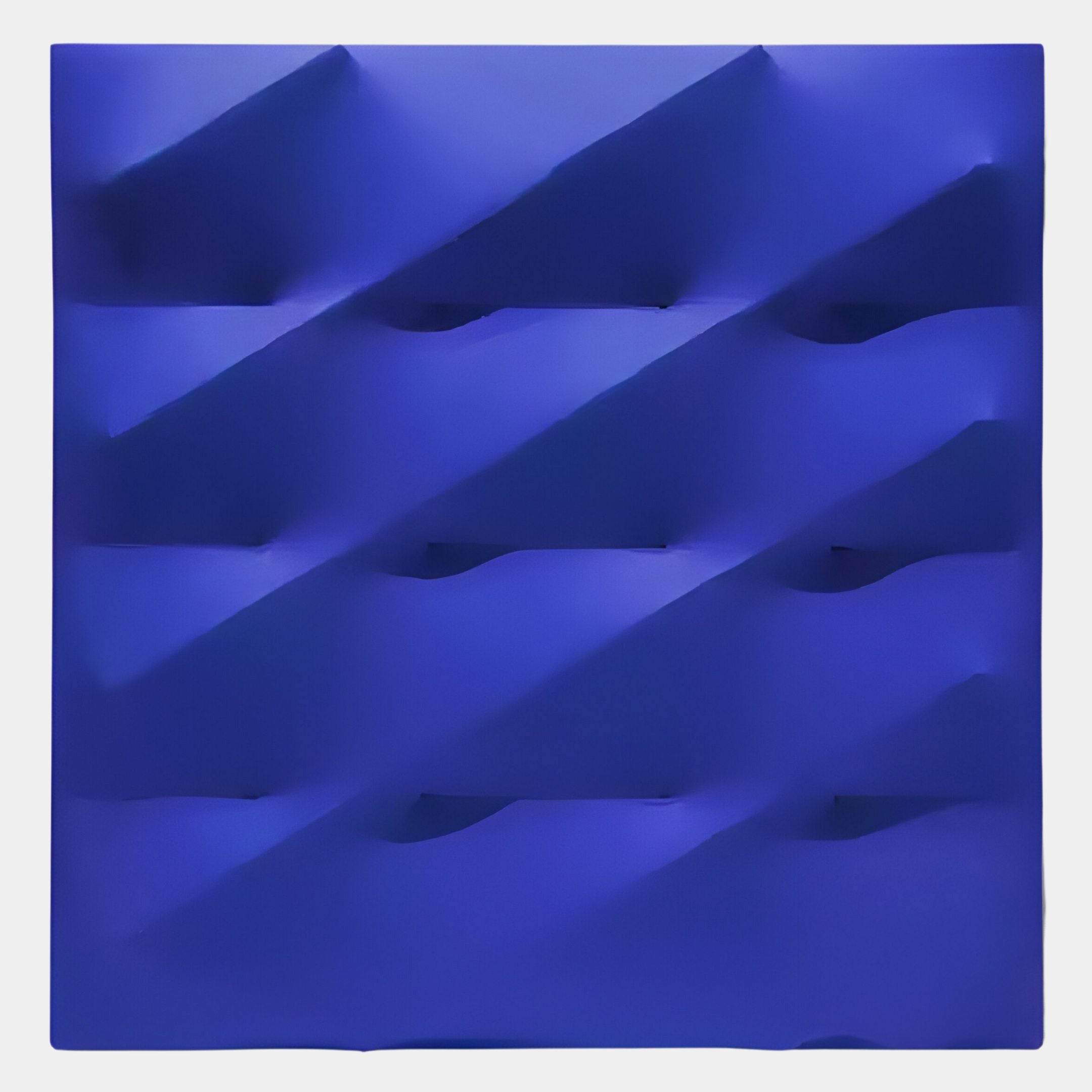 The Verto Deep Blue Stretch Fabric Layered Wooden 3D Wall Art by Giant Sculptures is a square, abstract piece with diagonal ridges and shadowed indentations, perfect as minimalist geometric decor for modern interiors.