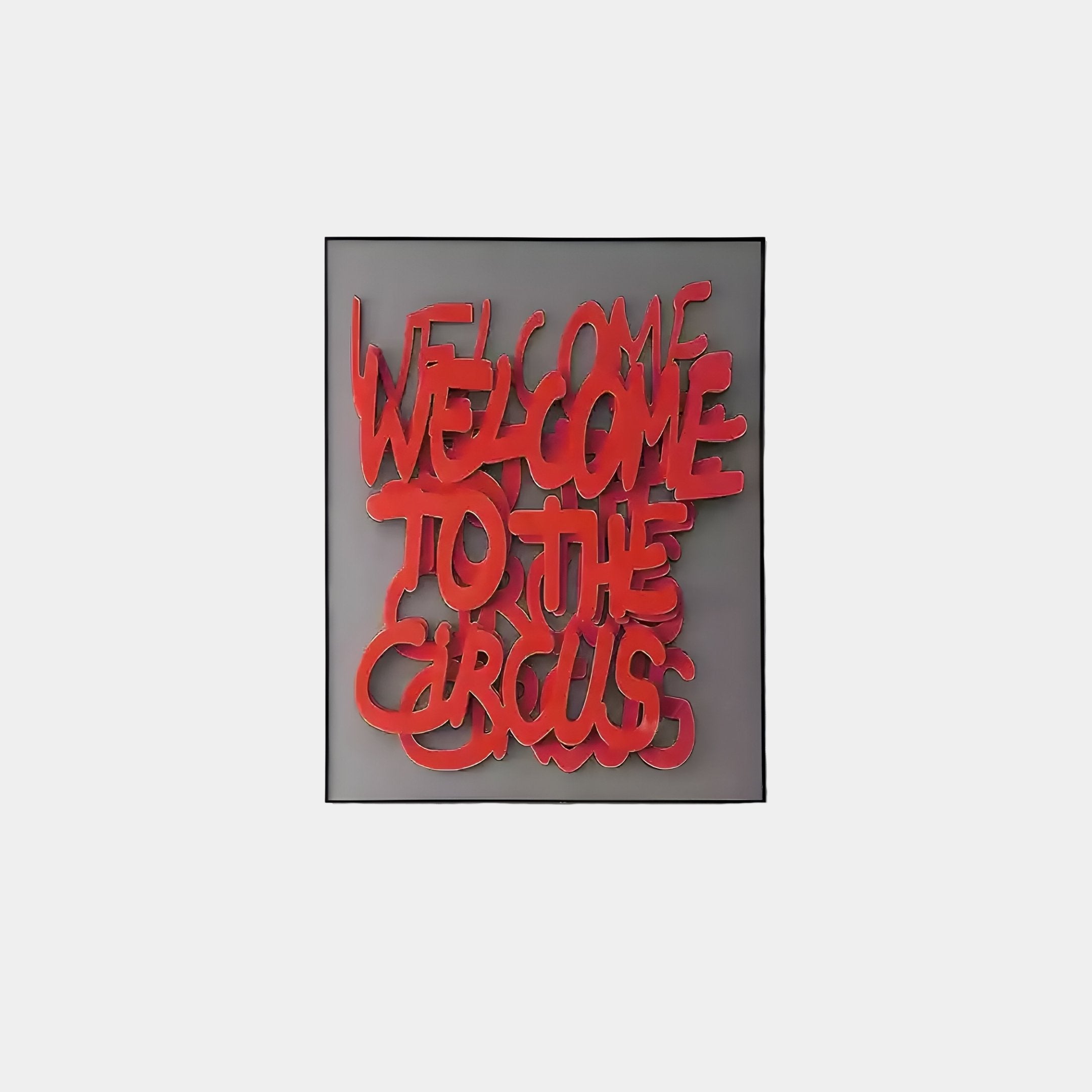 The image features the Urbanic Red Welcome Script 3D Wooden Graffiti Wall Art by Giant Sculptures, displaying bold red graffiti-style lettering that says Welcome to the Circus. The vibrant text stands out against a solid, light background, offering a striking contrast and artistic flair.