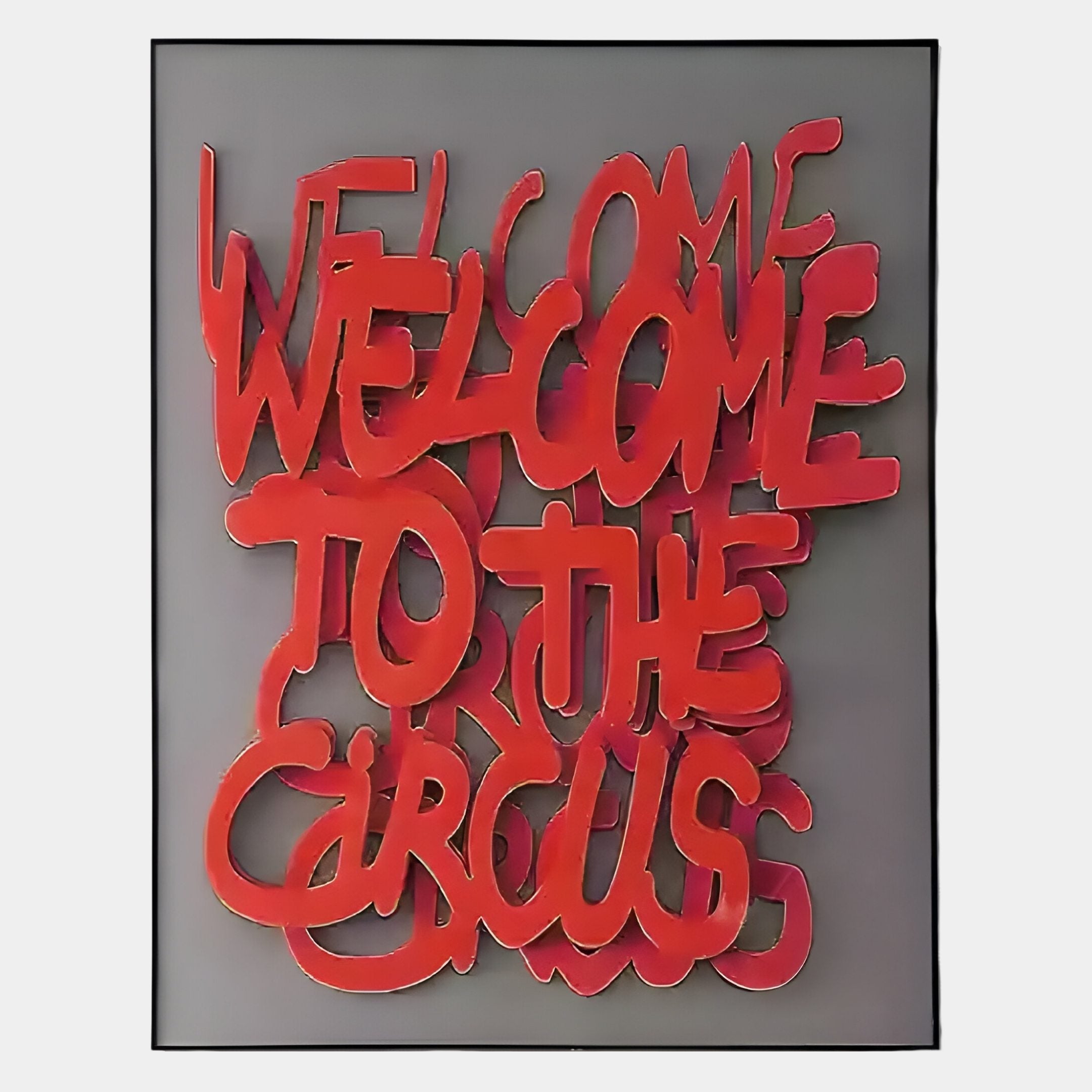The Urbanic Red Welcome Script 3D Wooden Graffiti Wall Art by Giant Sculptures features bold, red layered graffiti text reading WELCOME TO THE CIRCUS on gray, with a striking three-dimensional look in a sleek black frame.