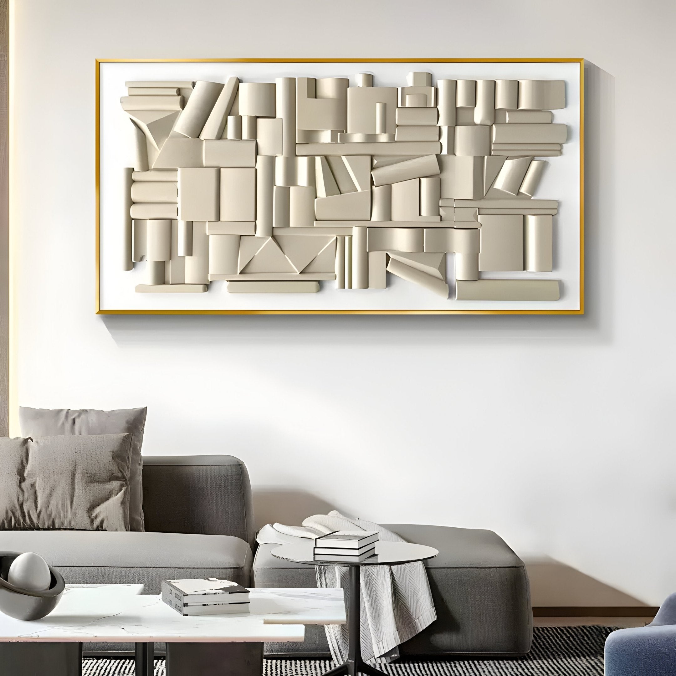 A modern living room includes a gray sofa and a low table with books. The wall features the Forma Cream Geometric 3D Wooden Vertical Wall Art by Giant Sculptures, enhancing its minimalist and contemporary design.
.