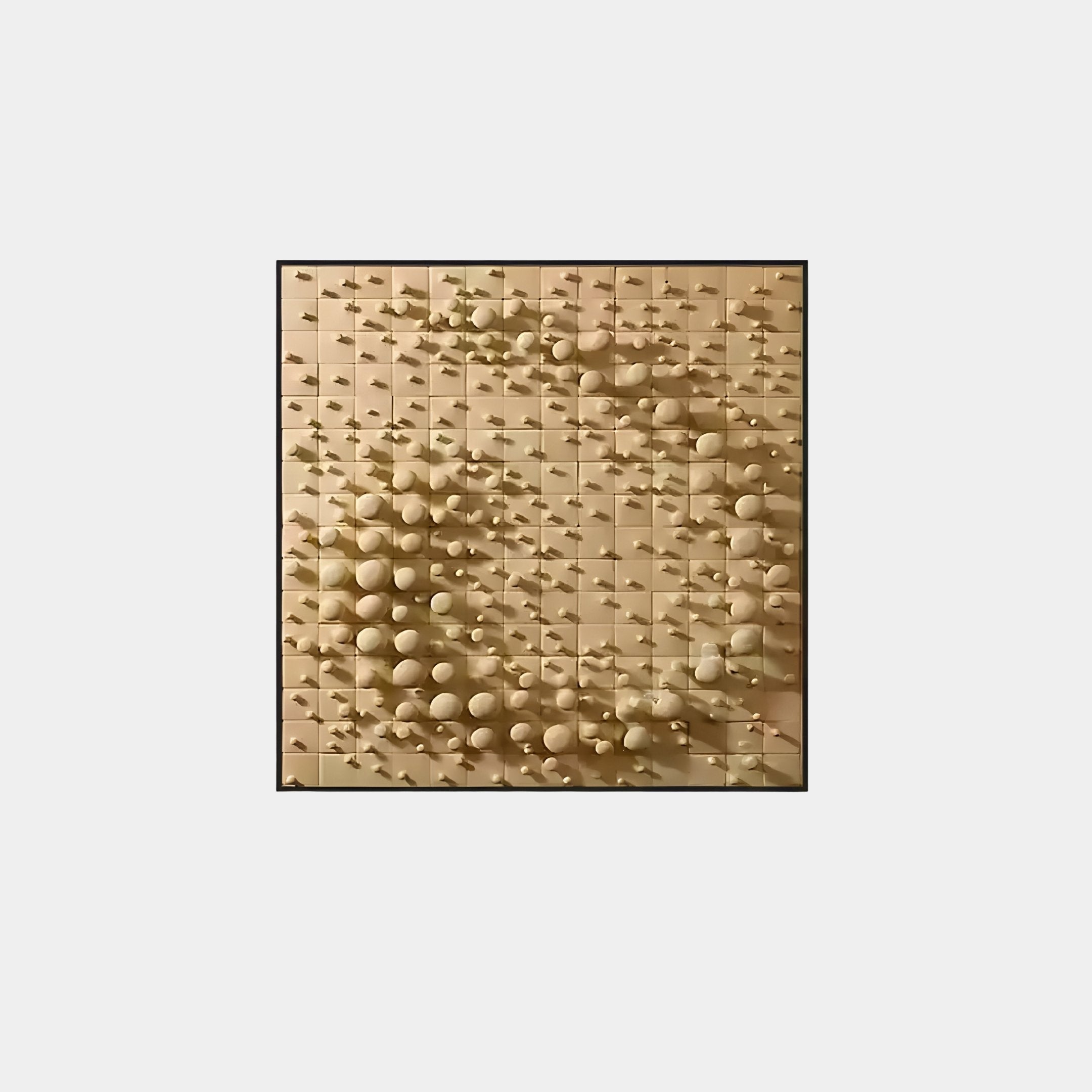 Giant Sculptures introduces the Orbila Circular Flow, where tiles are aligned with geometric precision to feature small wooden spheres. Central tiles hold larger spheres in a spiral pattern, crafting an eye-catching 3D wall art illusion with a soft beige palette.