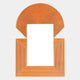 The Aurellis Terracotta Arch & Square Geometric Mirror Frame Wall Art by Giant Sculptures features concentric orange lines forming a rectangular base and semicircular top, elegantly framing a central white rectangle.