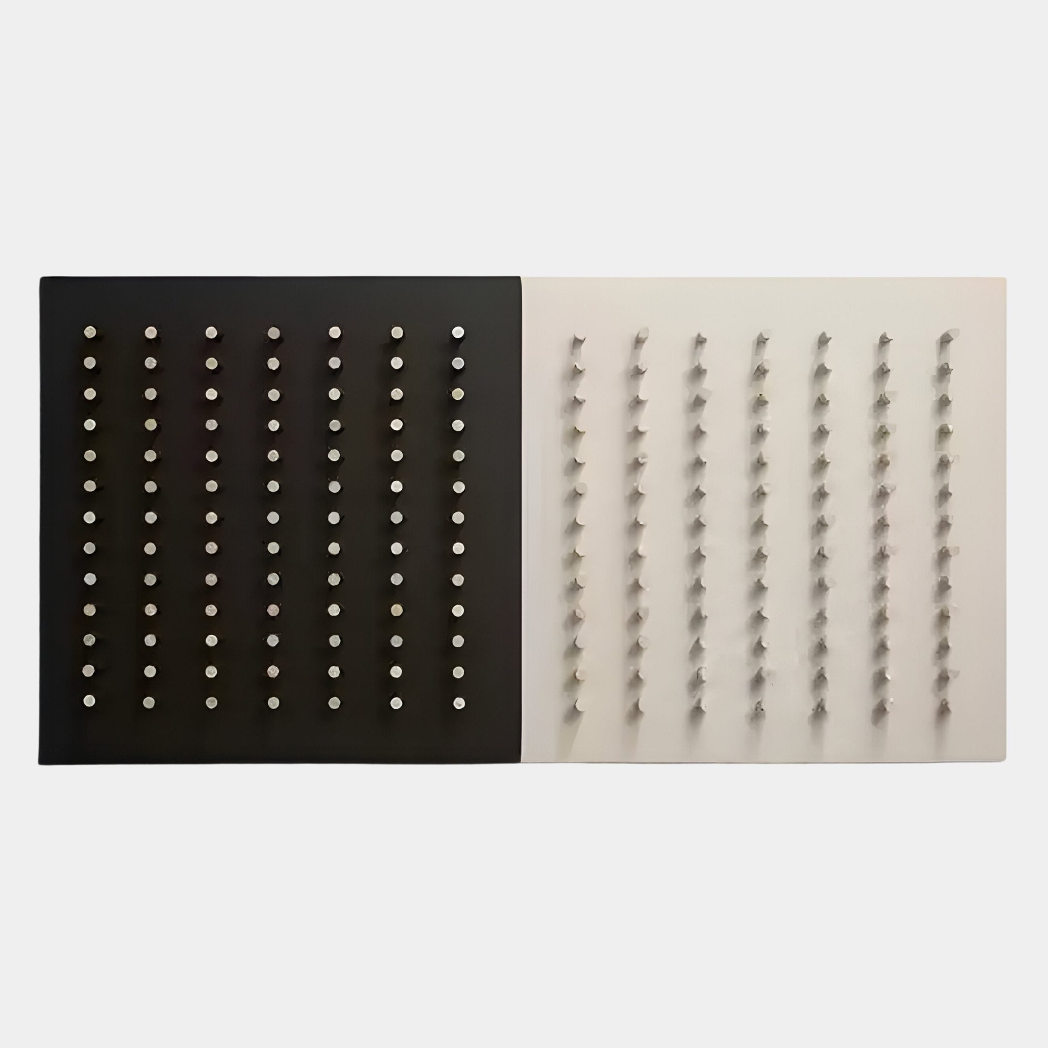 The Contrasto Dual-Tone Geometric 3D Wooden Wall Art by Giant Sculptures features a black left half with silver pegs in neat rows and a white right half with matching pegs casting diagonal shadows, perfect for modern spaces.