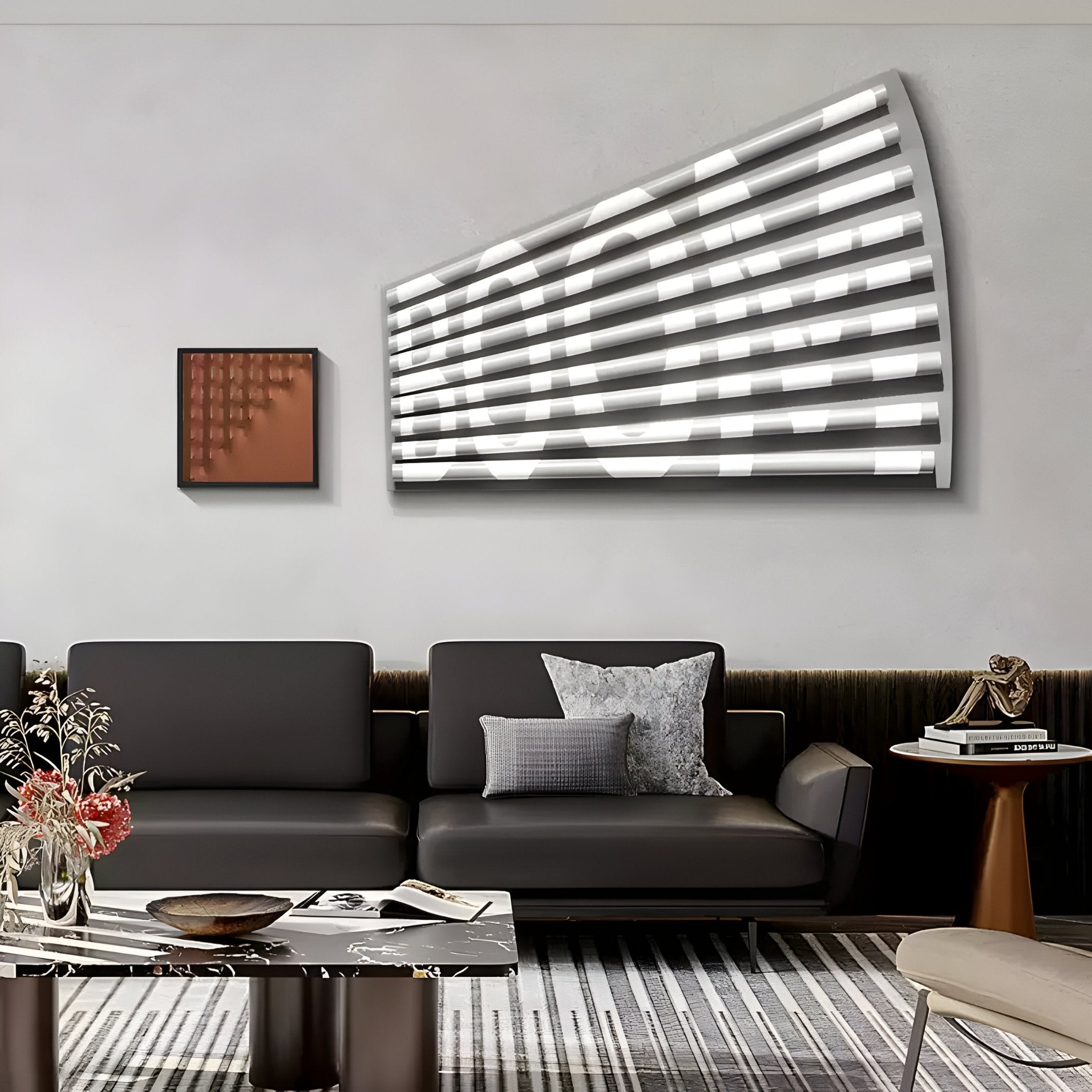 A modern living room features a gray sofa, a patterned rug, and the striking Illustra Bronze Highlight BOOM Text 3D Wooden Wall Art by Giant Sculptures with horizontal white lines on a curved surface. A small brown-tone painting sits nearby, and a side table with decor and flowers adds charm to the solid wood setting.