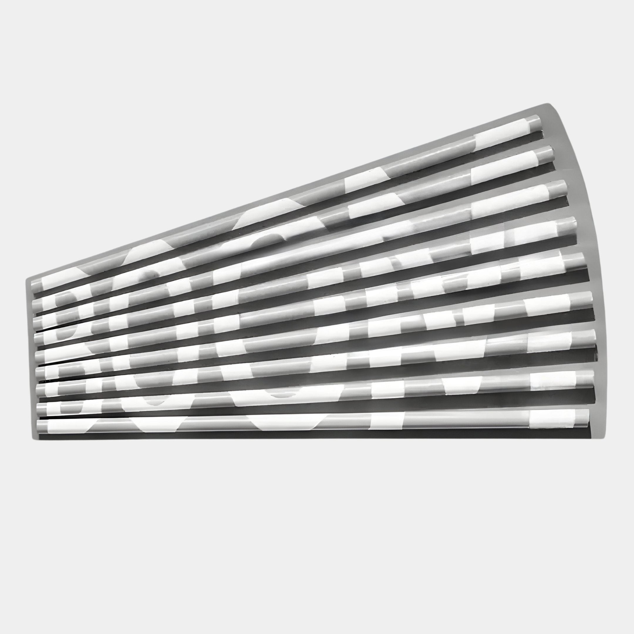 The Illustra Minimalist BOOM Text 3D Wooden Wall Art by Giant Sculptures features a wall-mounted, semi-circular slatted design that partially reveals bold white BOOM lettering against a grey background.