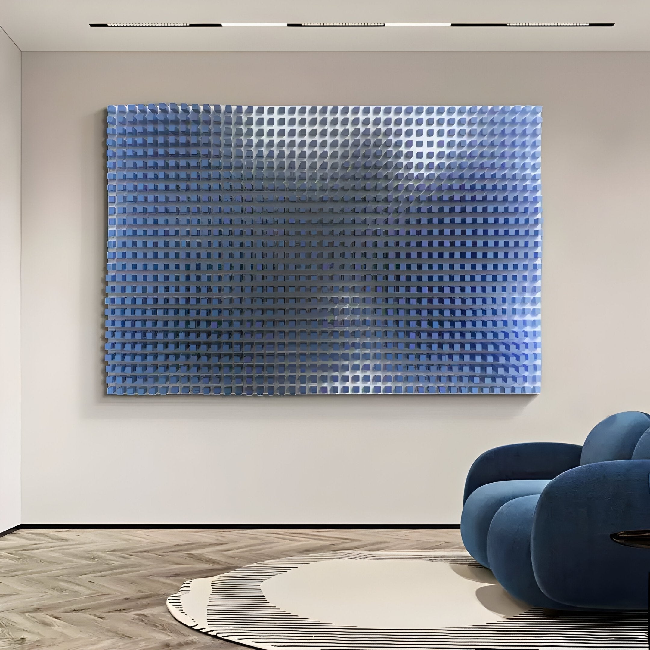 A modern interior highlights Giant Sculptures Wavluxe Gradient Blue Wood Mosaic 3D Wall Art. Below, a plush blue chair with rounded shapes sits on a floor of wooden mosaic design, enhanced by a circular striped rug.