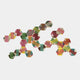 The Spectra I Multicoloured Interwoven Hexagonal Frame 3D Wall Art by Giant Sculptures features translucent green, pink, yellow, and orange hexagons forming an abstract, interconnected display on a plain white background.