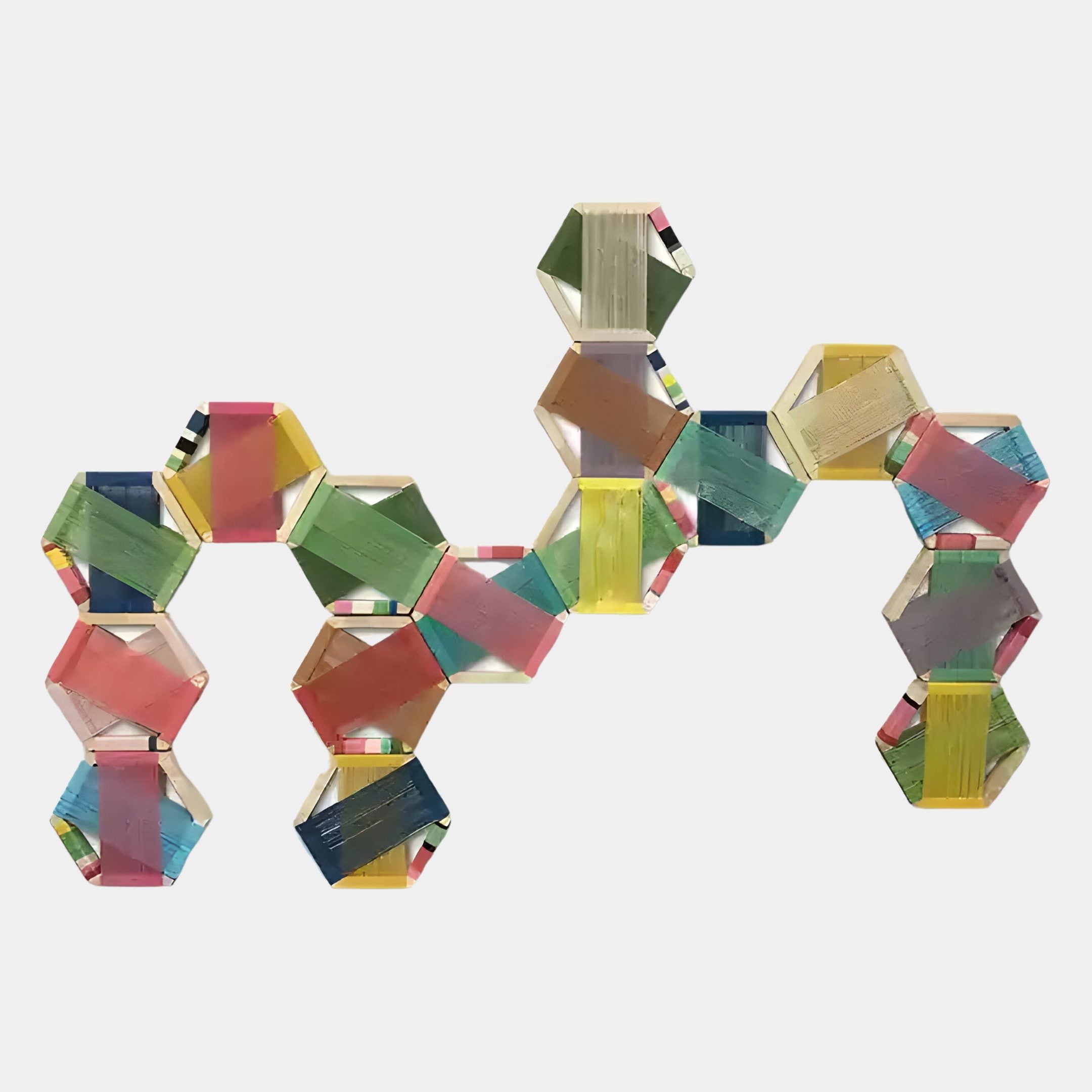 The Spectra II Multicoloured Interwoven Hexagonal Frame 3D Wall Art by Giant Sculptures features vibrant, translucent hexagons with playful patterns, artfully arranged in a wavy line for a striking geometric display.