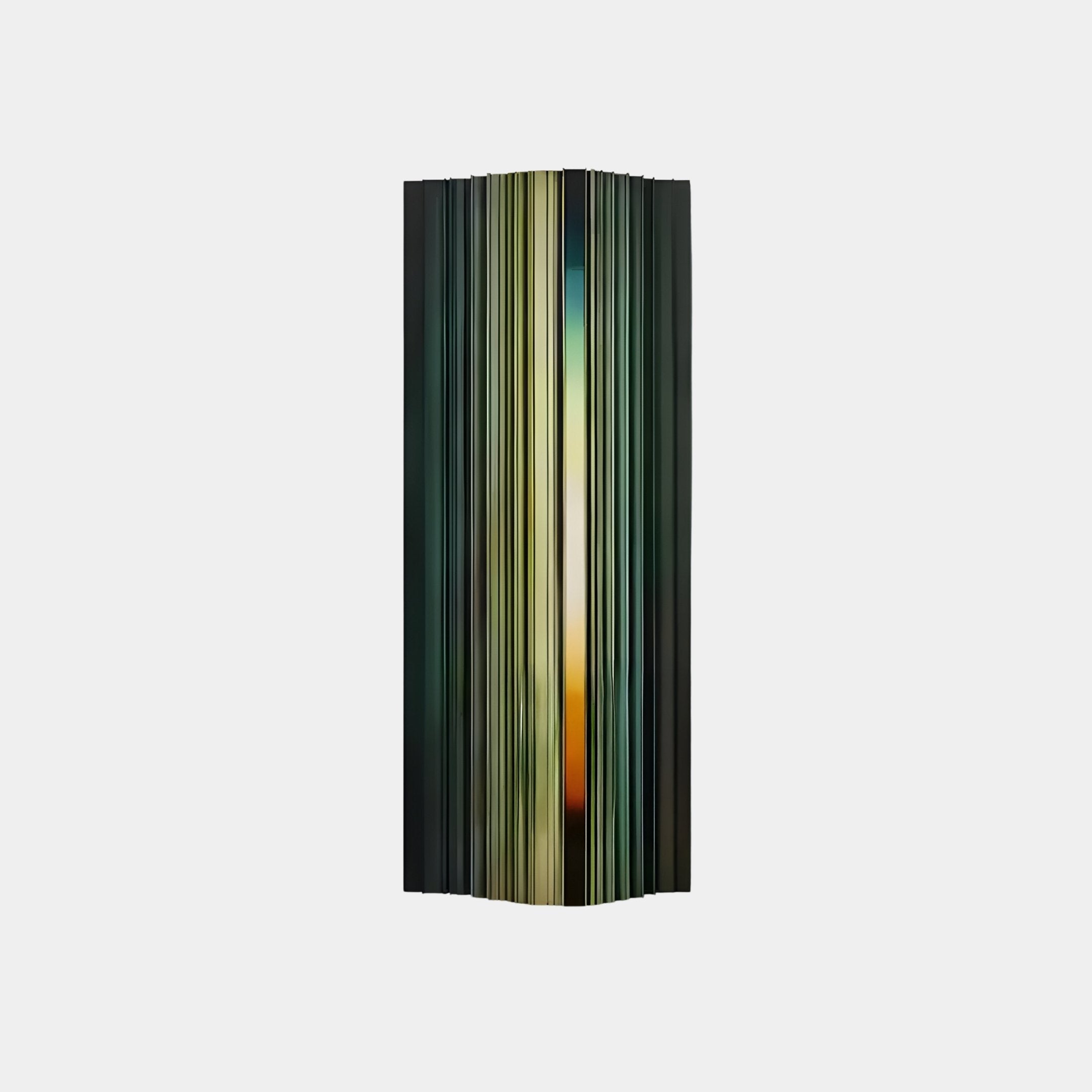 The Illumina Green Colourful Vertical Wooden Hand-Painted 3D Wall Art by Giant Sculptures is a tall, symmetrical abstract sculpture with vertical stripes in green, yellow, and orange on a light gray background, creating depth and movement with its hand-painted design.