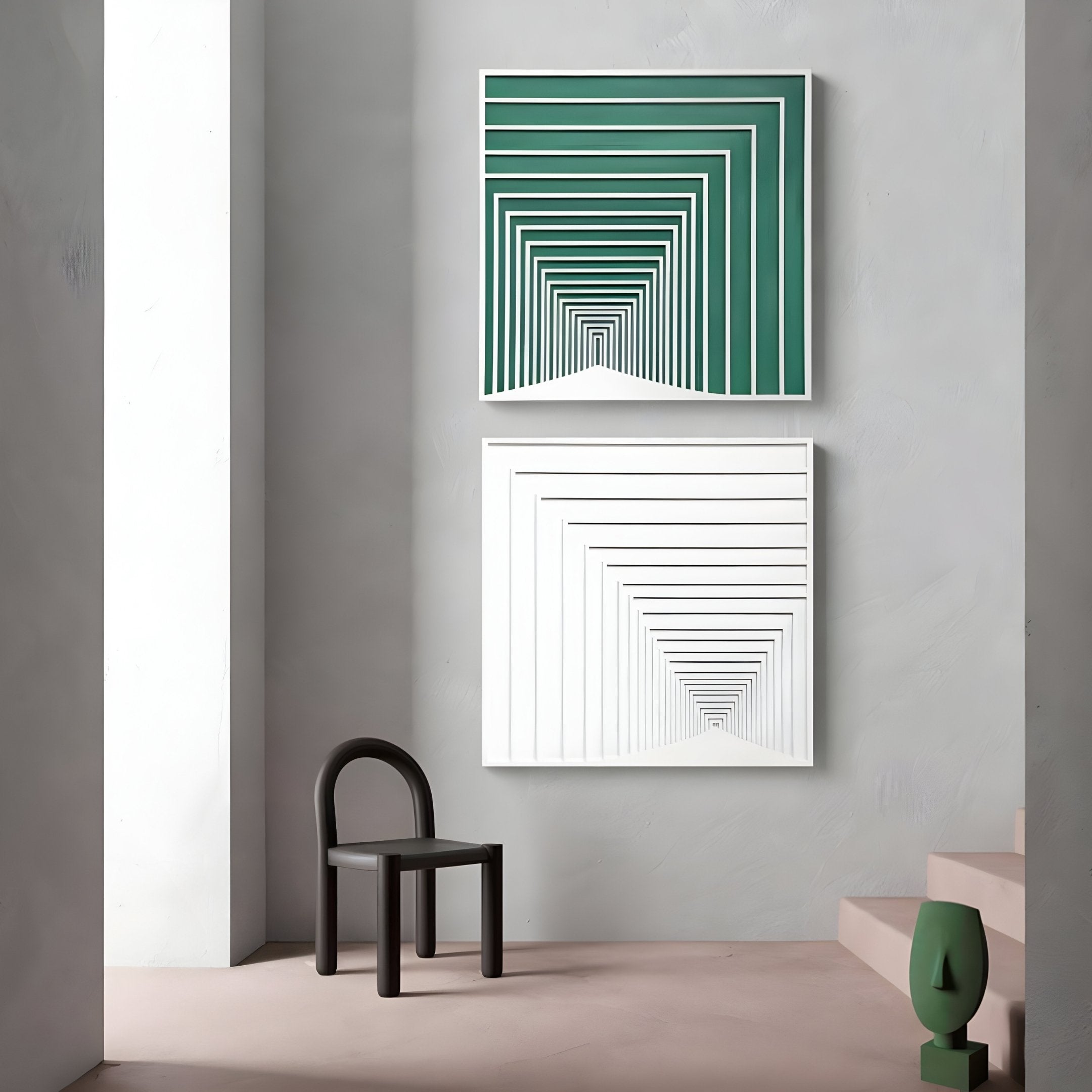 A minimalistic room showcases Giant Sculptures Prismalux 3D wall art, featuring two geometric pieces: the top in green and white concentric squares, the bottom in black and white. A black chair rests against the wall, complemented by a staircase enhancing the minimalist design on the right.