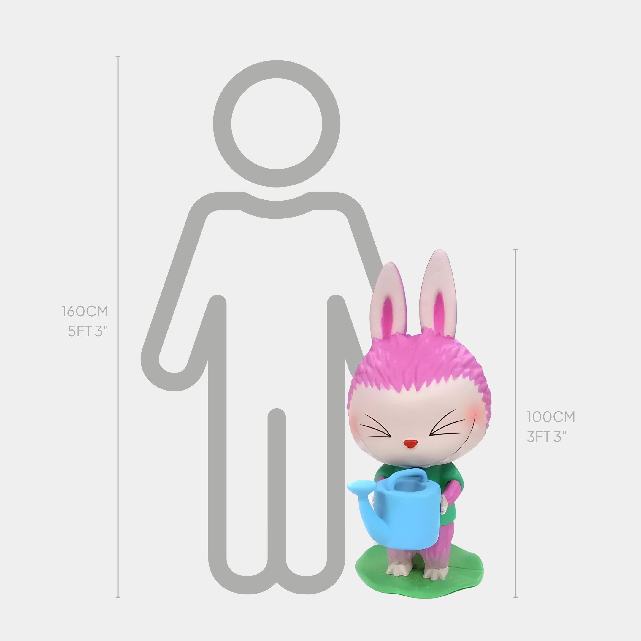 The Flower Elves Water Lilies Labubu Sculpture by Giant Sculptures stands 100 cm (3 ft 3 in) tall next to a 160 cm (5 ft 3 in) illustrated person for scale. The pink and white bunny holds a blue watering can.