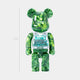 The Woodland Beads Bear Sculpture by Giant Sculptures is a 70cm tall resin bear with a green marbled finish and a clear chest compartment filled with blue and white capsules.
