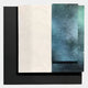 The Astra Midnight Teal Textured Wood Carving 3D Wall Art by Giant Sculptures features layered rectangular panels—a textured white piece and a smooth, midnight teal speckled panel—set against a black background for striking 3D effect.