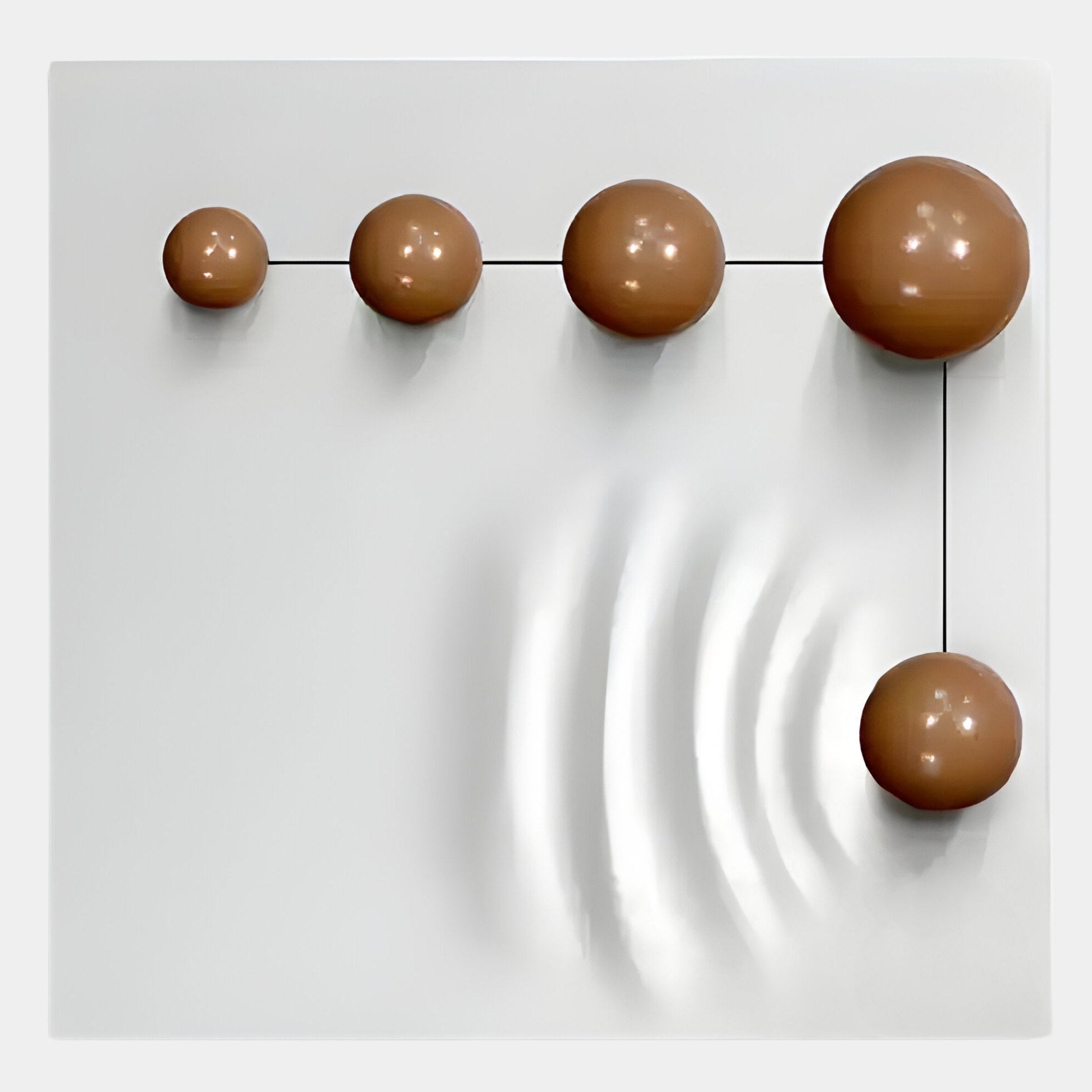 Galactica White Wood Relief 3D Wall Art With Linear Brown Metal Ball by Giant Sculptures features five increasing-size brown metal balls connected by black lines on a white panel, with the largest sphere’s wave patterns suggesting dynamic movement.