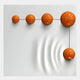 Five glossy orange metal balls form an L-shape on a white wood relief panel, connected by thin black lines. The largest ball creates ripples, making the Galactica 3D Wall Art by Giant Sculptures ideal for modern or minimalist decor.