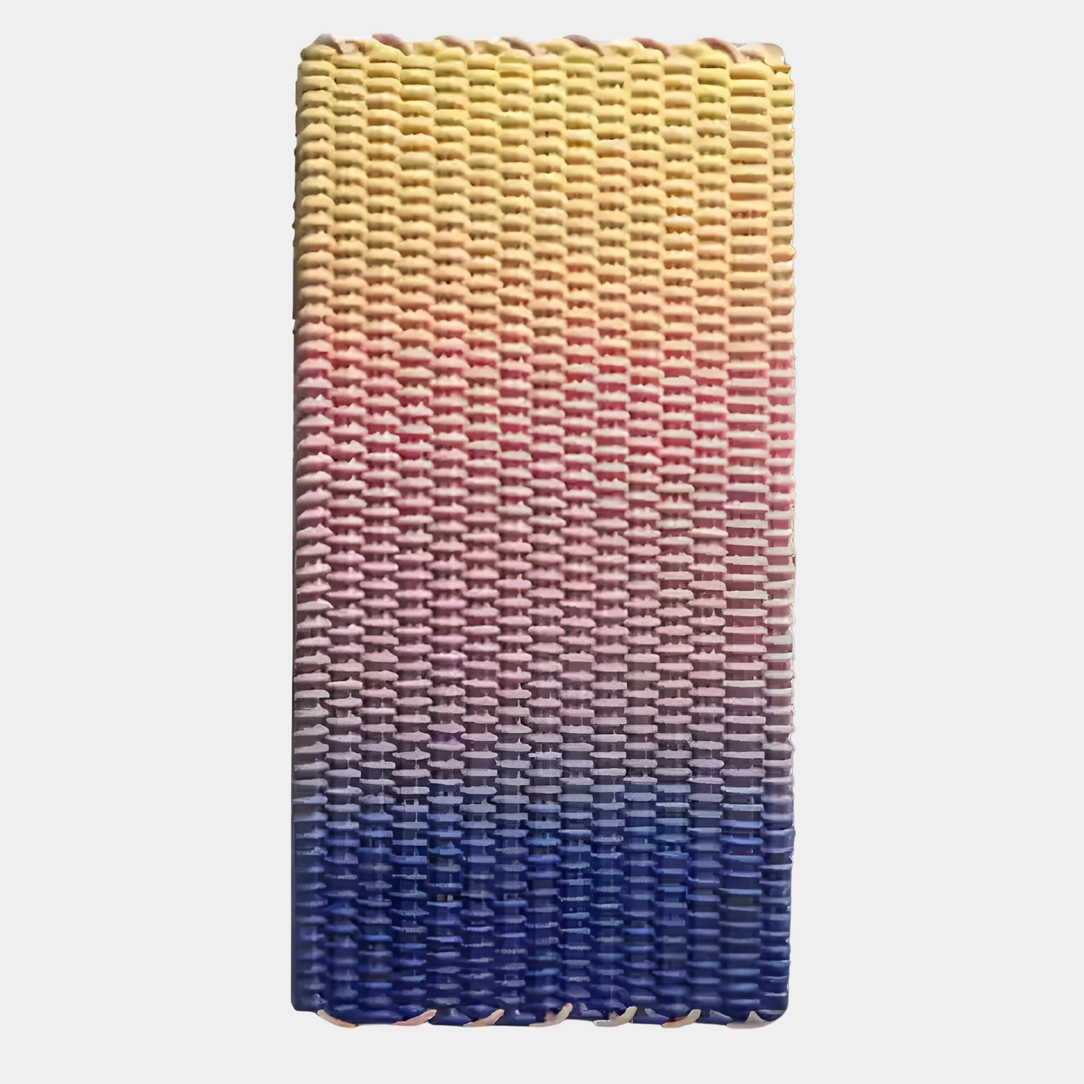 The Spectrum Weave Vertical Sunset Hues Wood Relief 3D Wall Art by Giant Sculptures features a yellow-to-pink-to-blue gradient, creating a striking sunset effect and bold wall decor against a white background.