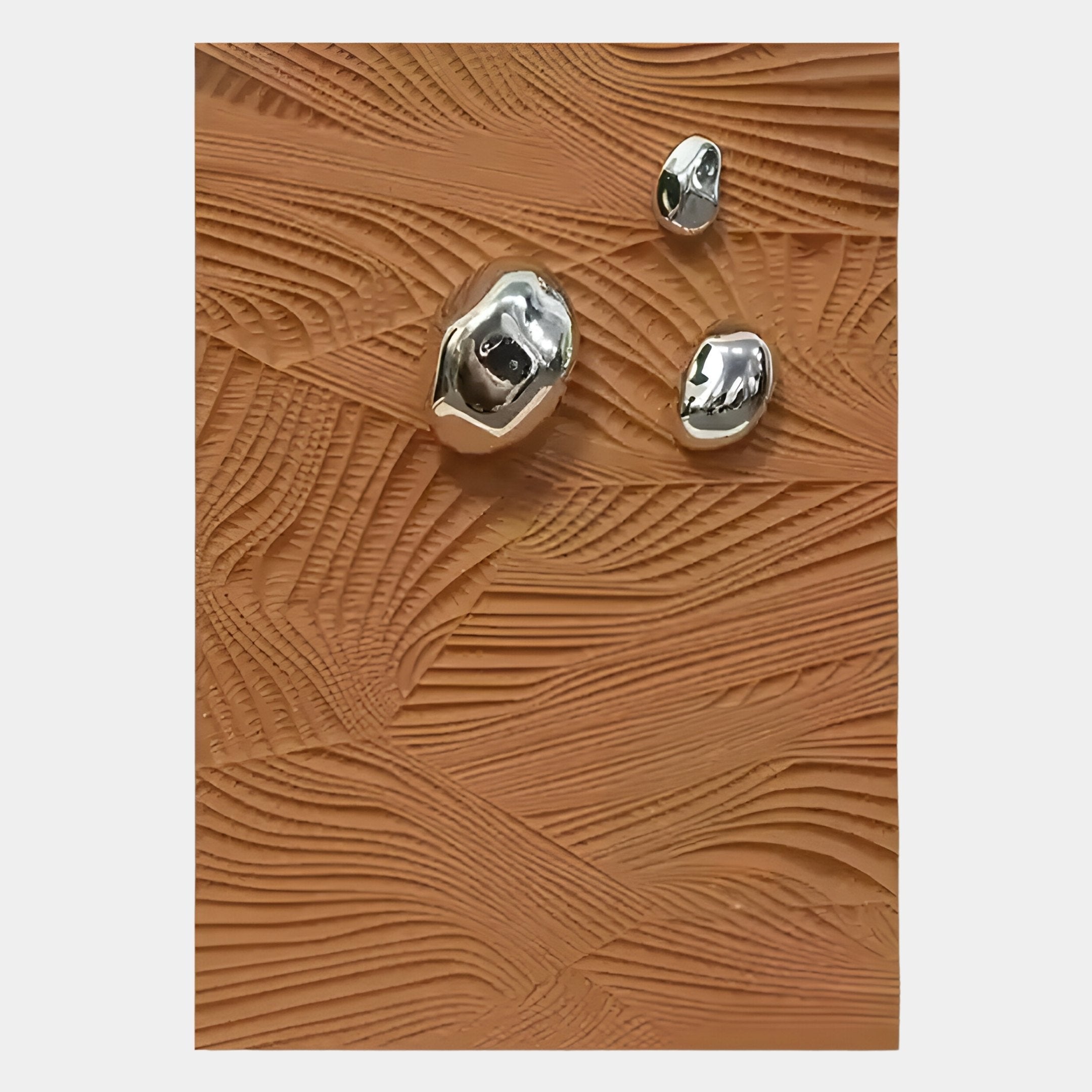 The Verdara Terracotta Wood Relief 3D Wall Art by Giant Sculptures showcases a textured brown surface with raised wavy lines and three irregular silver metallic accents, offering organic warmth in modern decor.