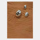 The Verdara Terracotta Wood Relief 3D Wall Art by Giant Sculptures showcases a textured brown surface with raised wavy lines and three irregular silver metallic accents, offering organic warmth in modern decor.