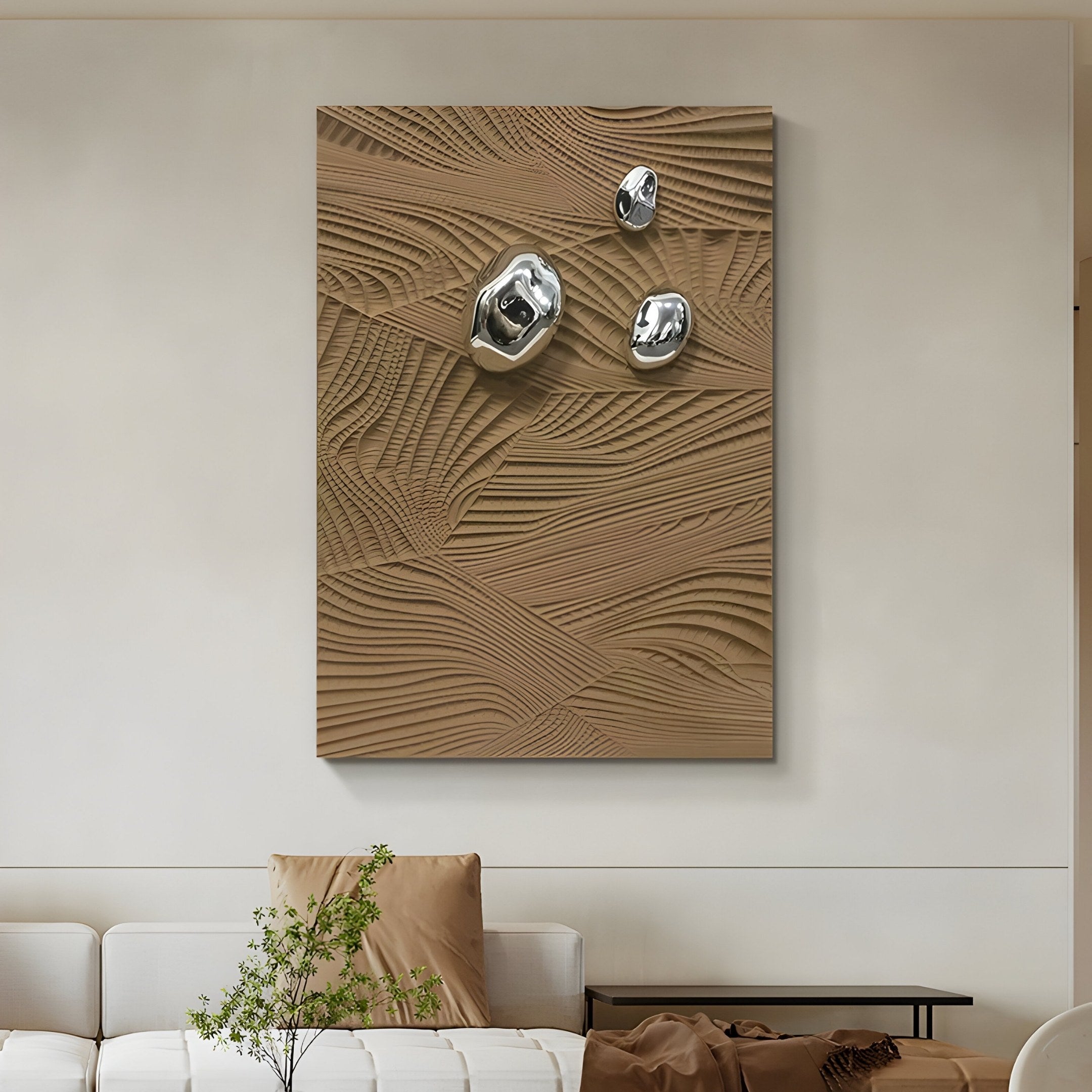 In the modern living room, the Verdara Taupe Wood Relief 3D Wall Art by Giant Sculptures features sculptural details with metallic spheres on a beige-patterned background. A white sofa with brown and beige cushions and a small potted plant complements the contemporary setting.