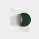 The Solvara Green & White Wood Relief 3D Wall Art by Giant Sculptures features a modern wall lamp with a semi-circular green shade and gold accent, mounted on a textured white surface with organic waves, contrasting smooth metallic elements against the bold geometric background.