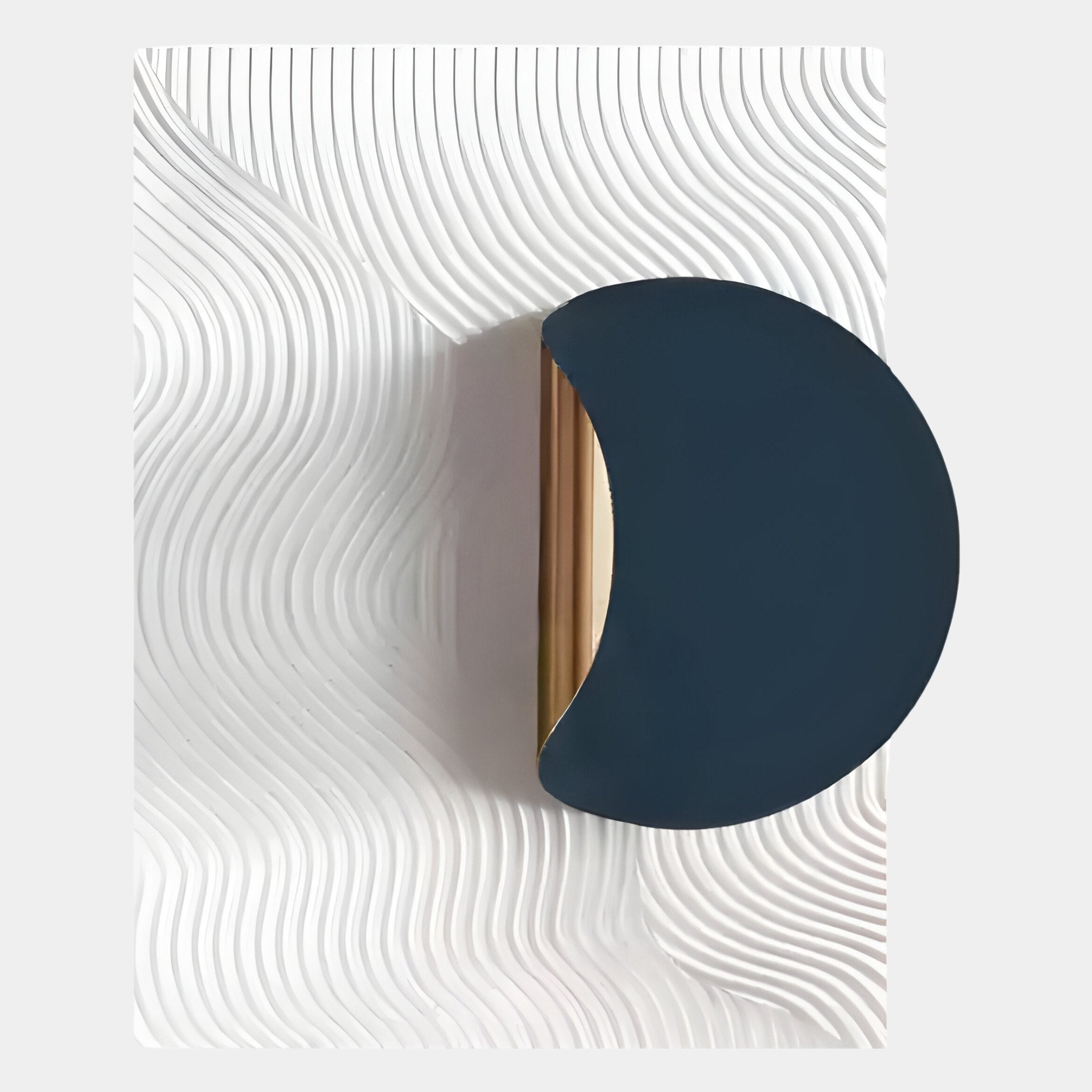 The Solvara Midnight Blue & White Wood Relief 3D Wall Art by Giant Sculptures features a semi-circular design with a metallic edge on a white surface with flowing, textured lines—an elegant piece of contemporary wall decor.