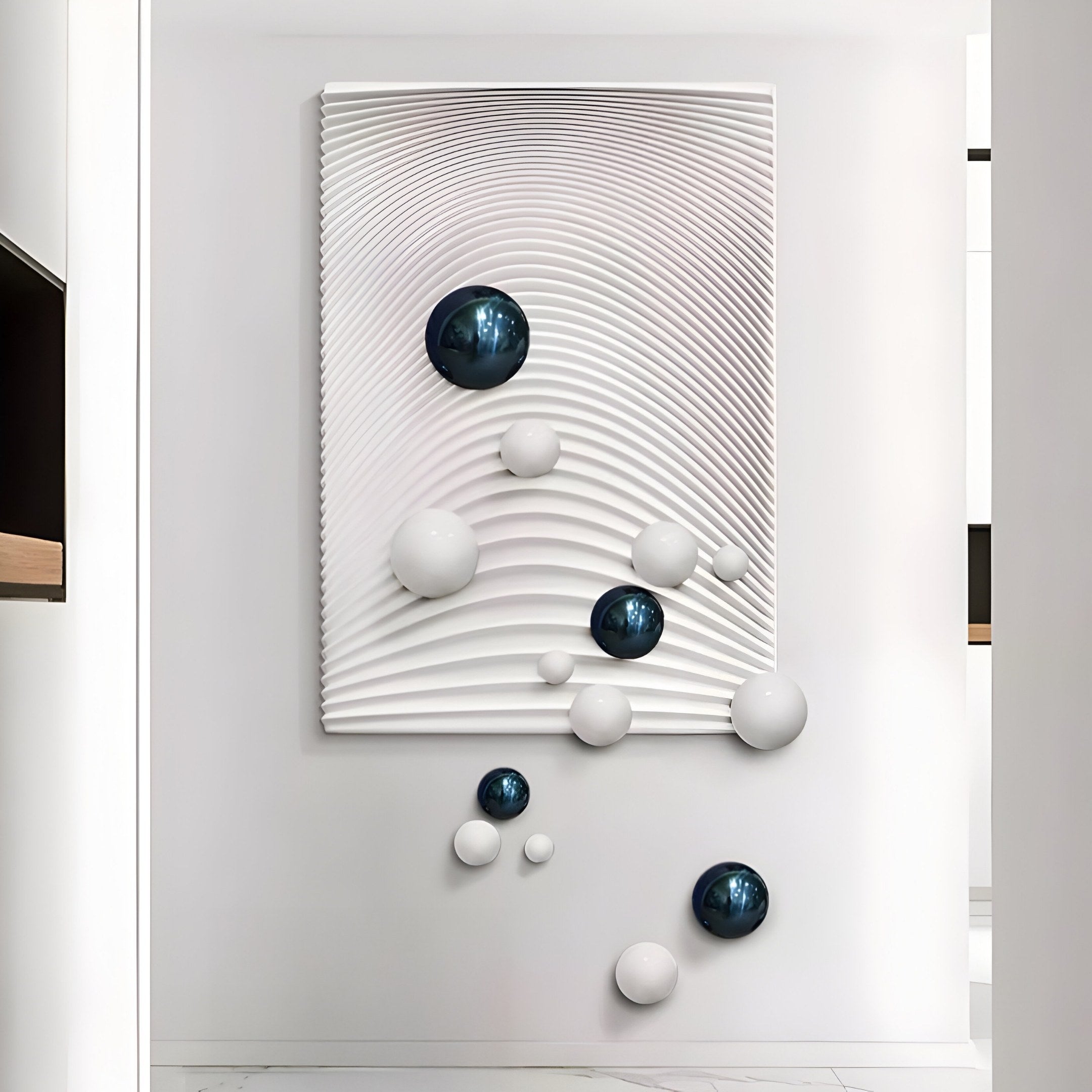 The Sphera White 3D Wood Relief Wall Art by Giant Sculptures showcases concentric ripples adorned with glossy dark blue and white metal spheres, creating a modern abstract effect with its metallic sheen.